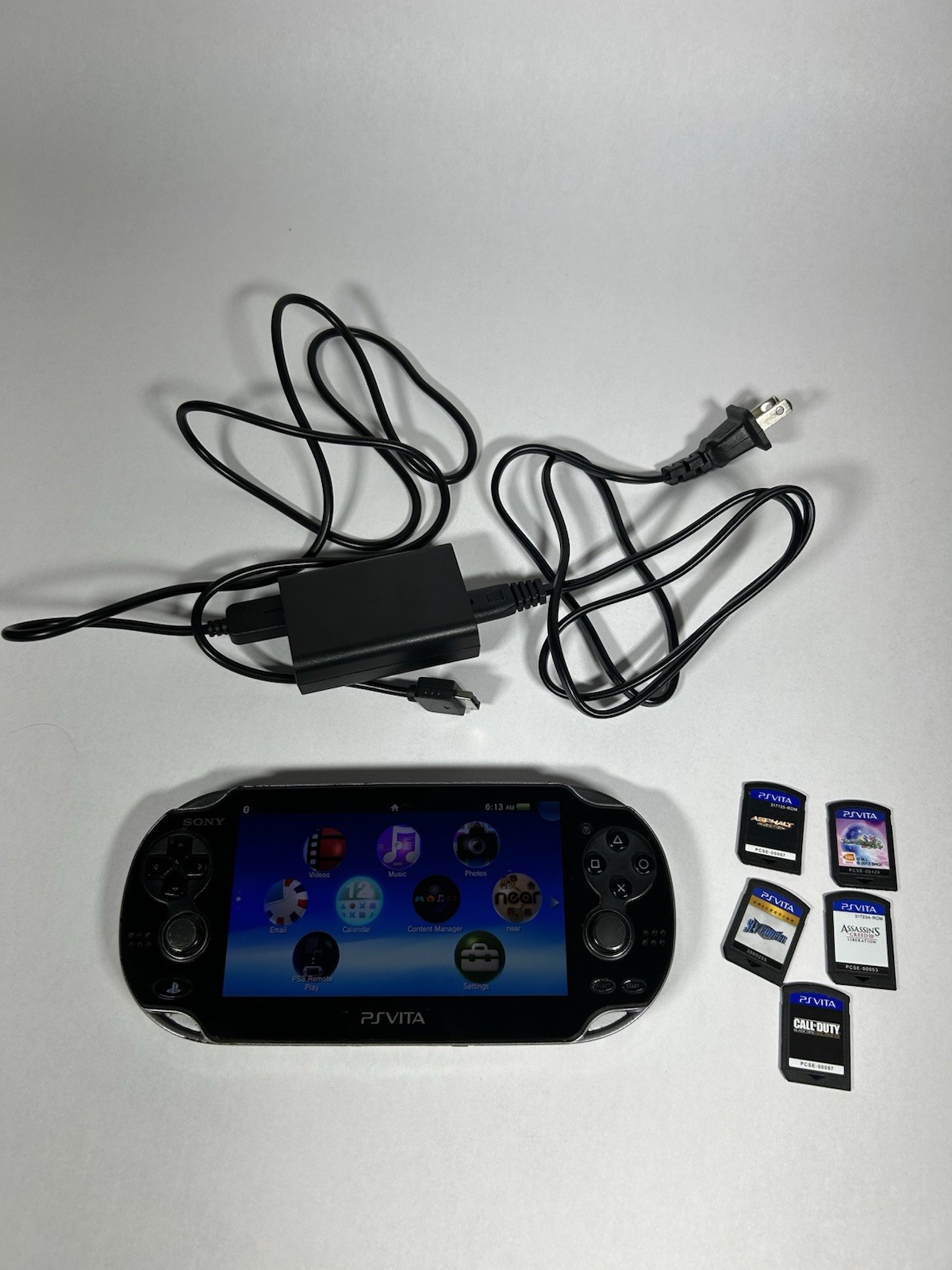 Sony PlayStation Vita PCH-1001 Black Handheld Console w/ Charger 5 Games Tested