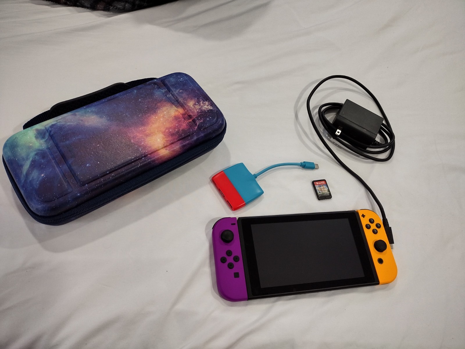 Nintendo Switch 32GB Orange and Purple JoyCons w/ case and Let’s Go Eevee