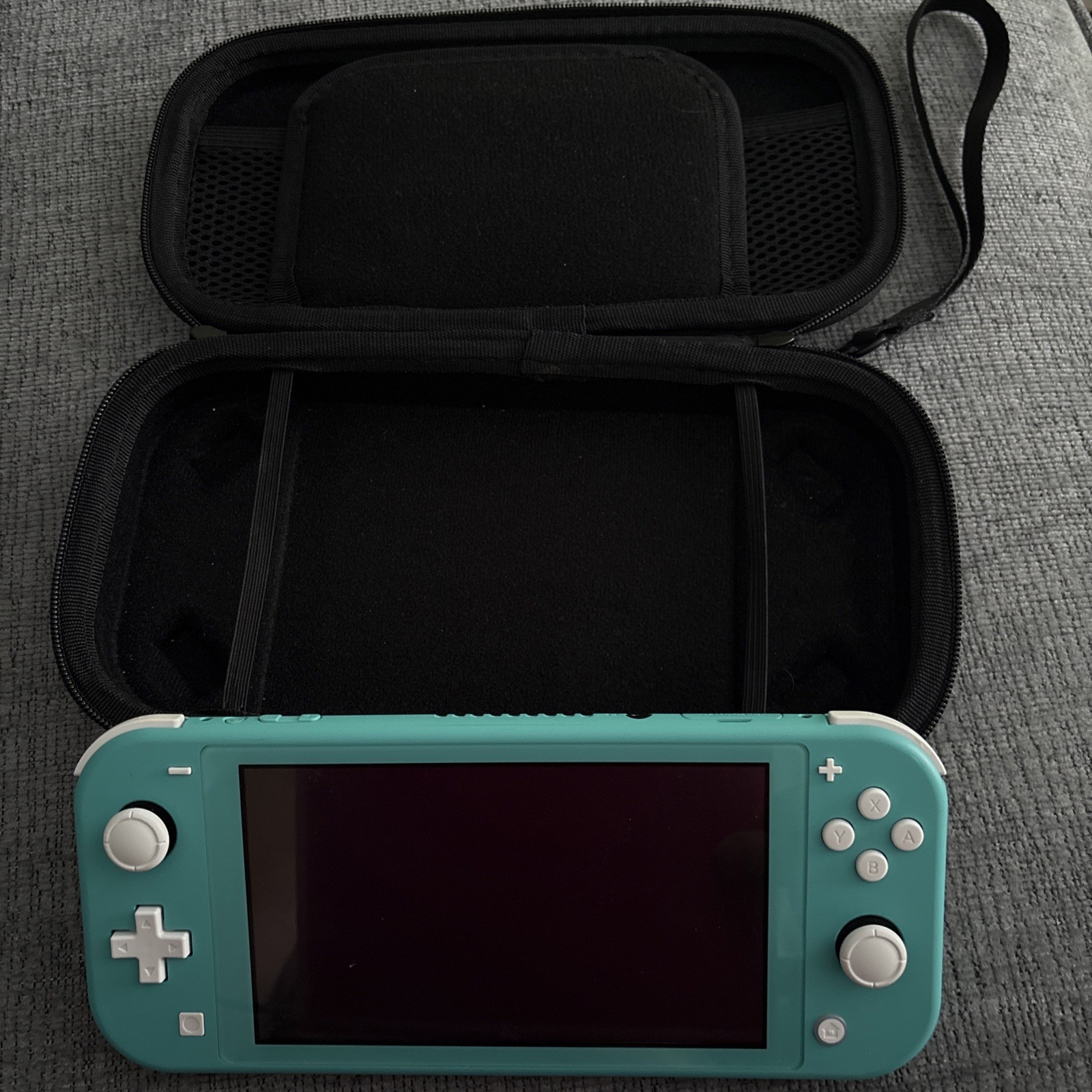 Nintendo Switch Lite 32GB Console in Turquoise with charger and carrying case