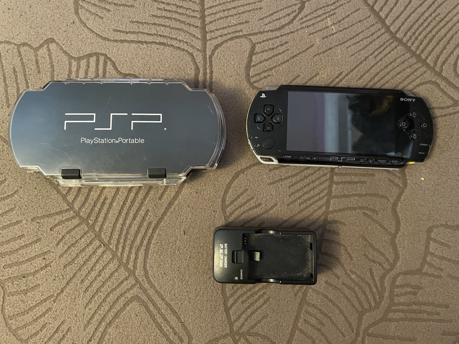 Sony PSP 1000 Black Handheld System with Clear Case & Charger Dock