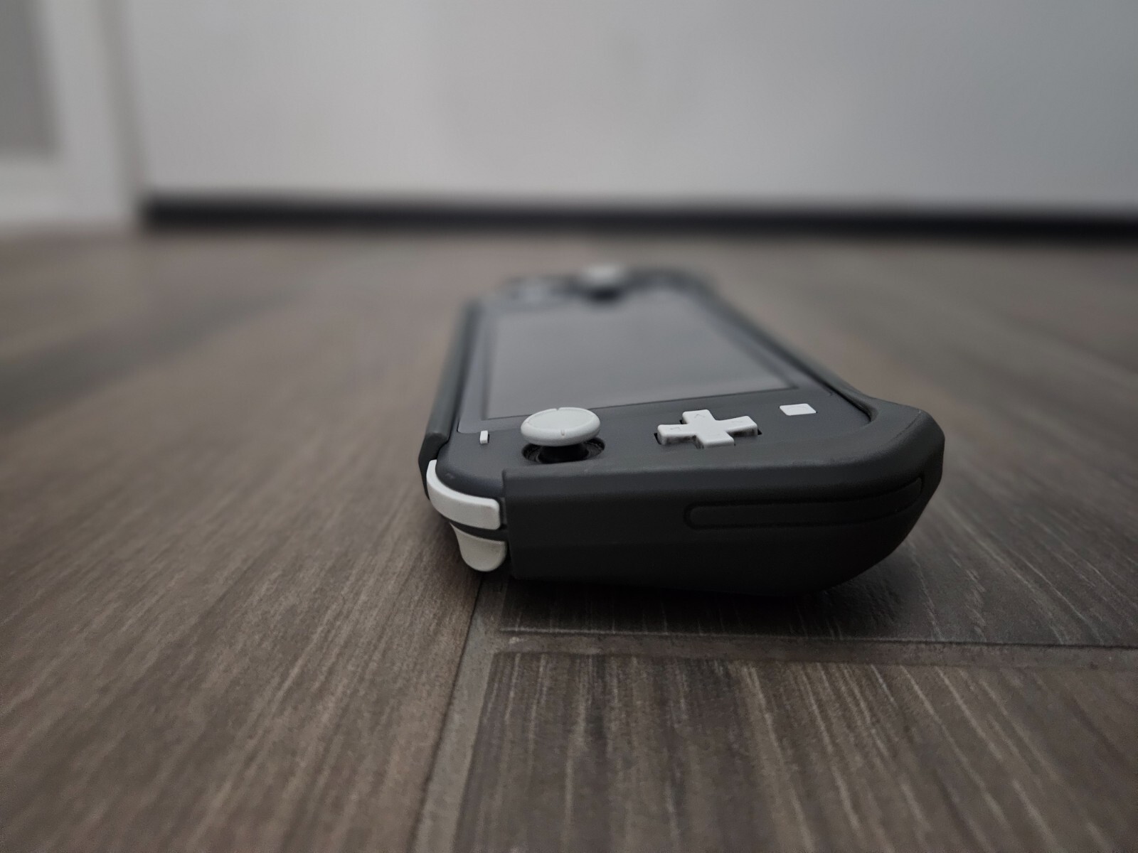 NINTENDO GREY SWITCH LITE, 240 GB storage, comes with matching case.