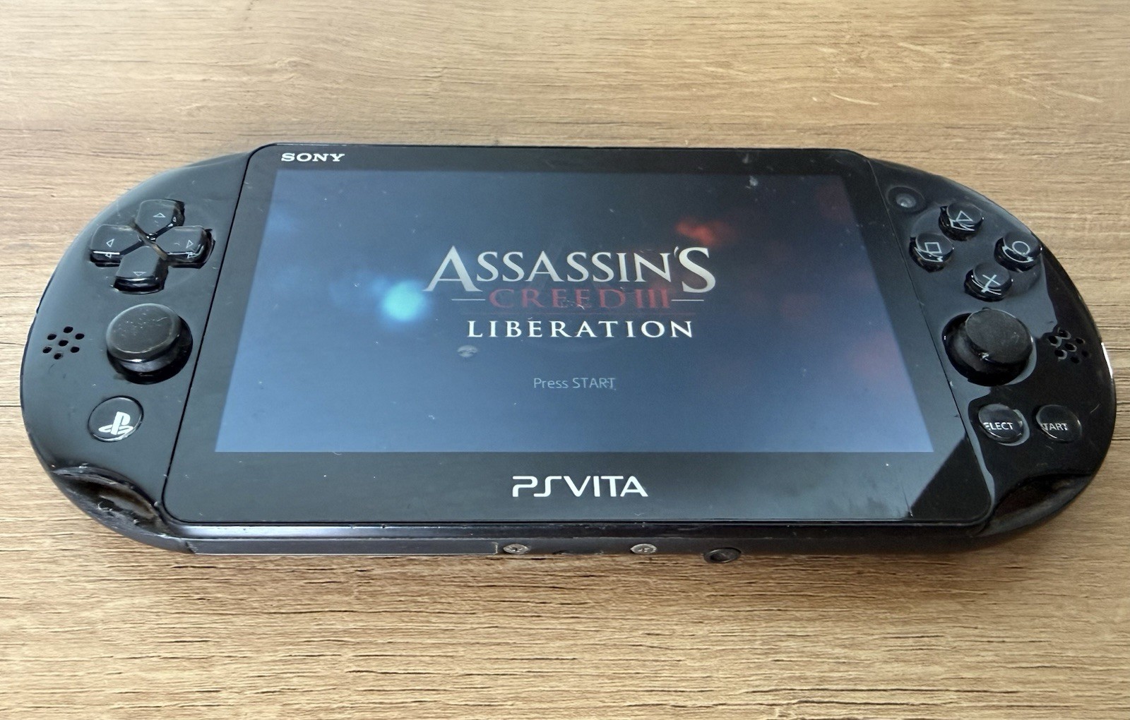 Sony PlayStation PS Vita 2001 w/ Assassins Creed – For Parts – Bad Left Joystick