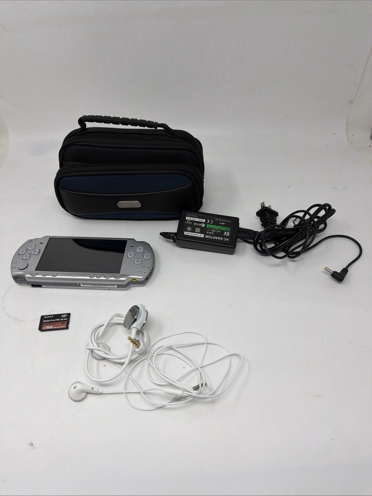 Sony PSP 2001 Silver W/ Sony 16gb, PSP OEM Bag, PSP-S120 Heatphone, Charger