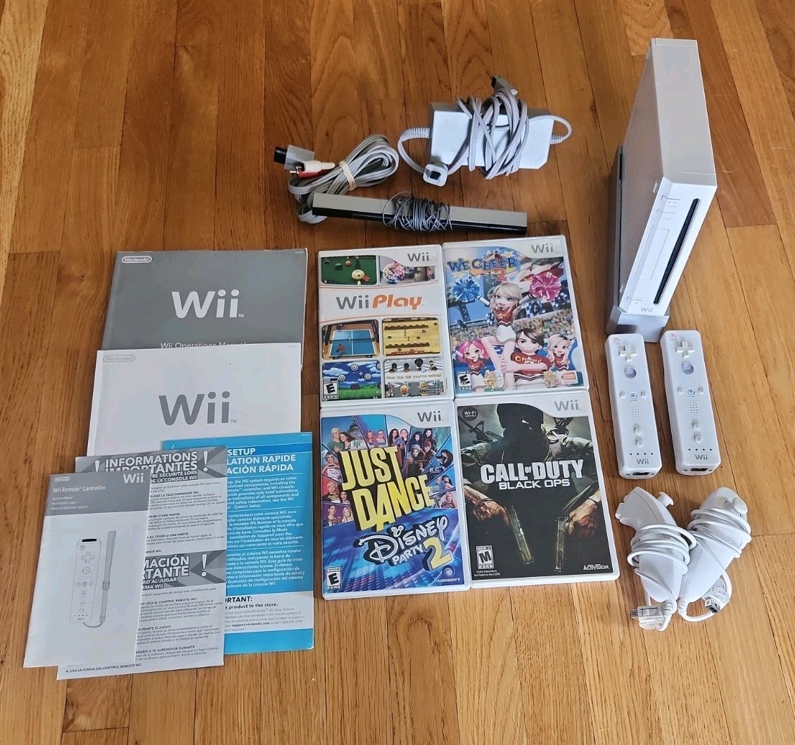 Nintendo Wii Console Bundle: 2 Remotes 2 Nunchucks, All Cords, 4 Games & Stand
