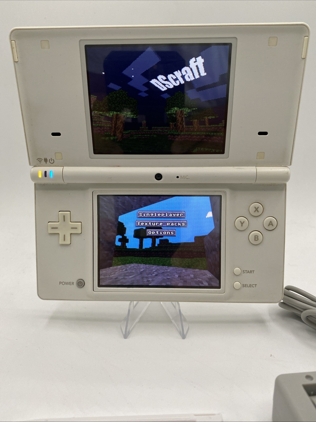 Nintendo DSi White – Includes Preloaded Library (Large Collection)
