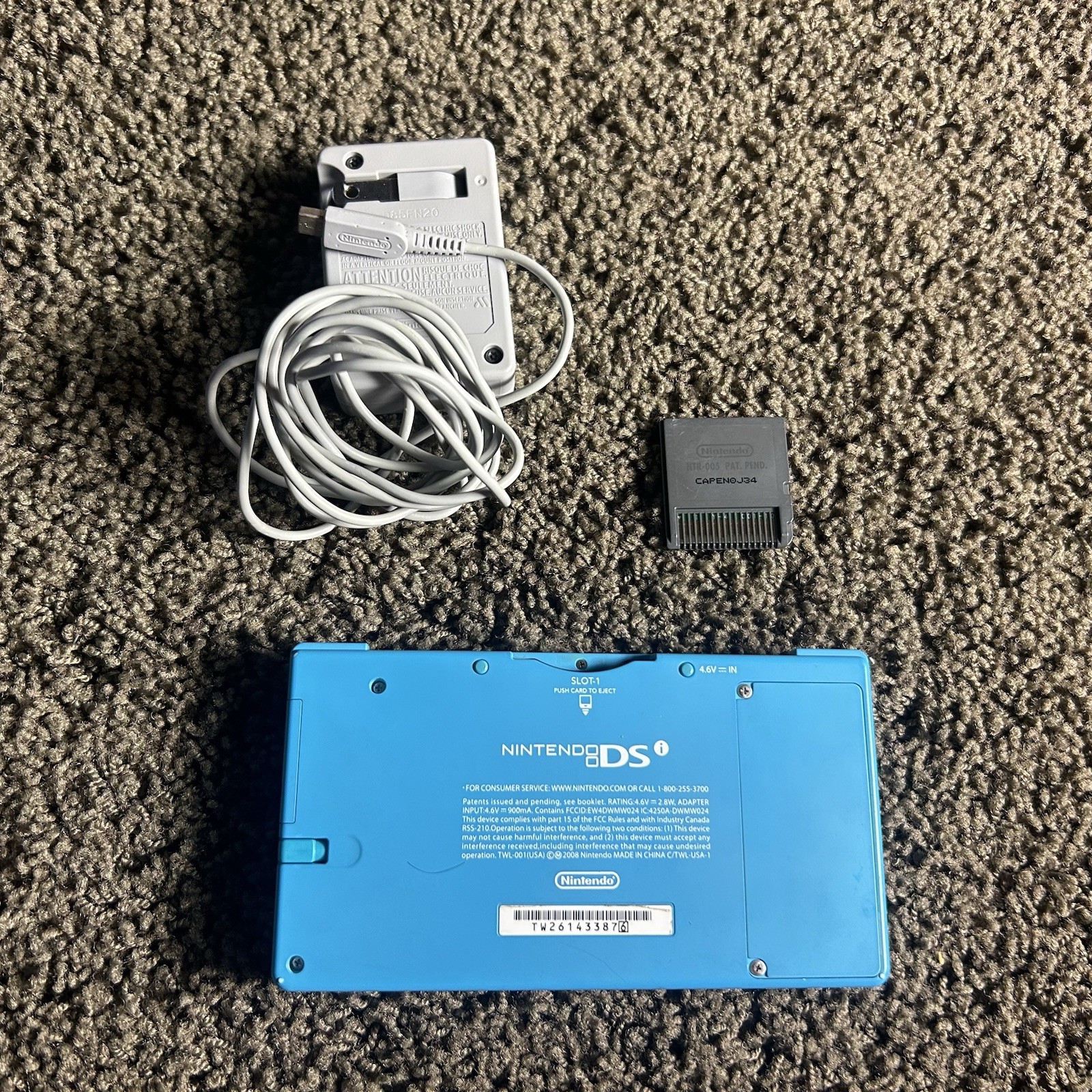 Nintendo DSi Light Blue Handheld Console Game System w Charger & Game