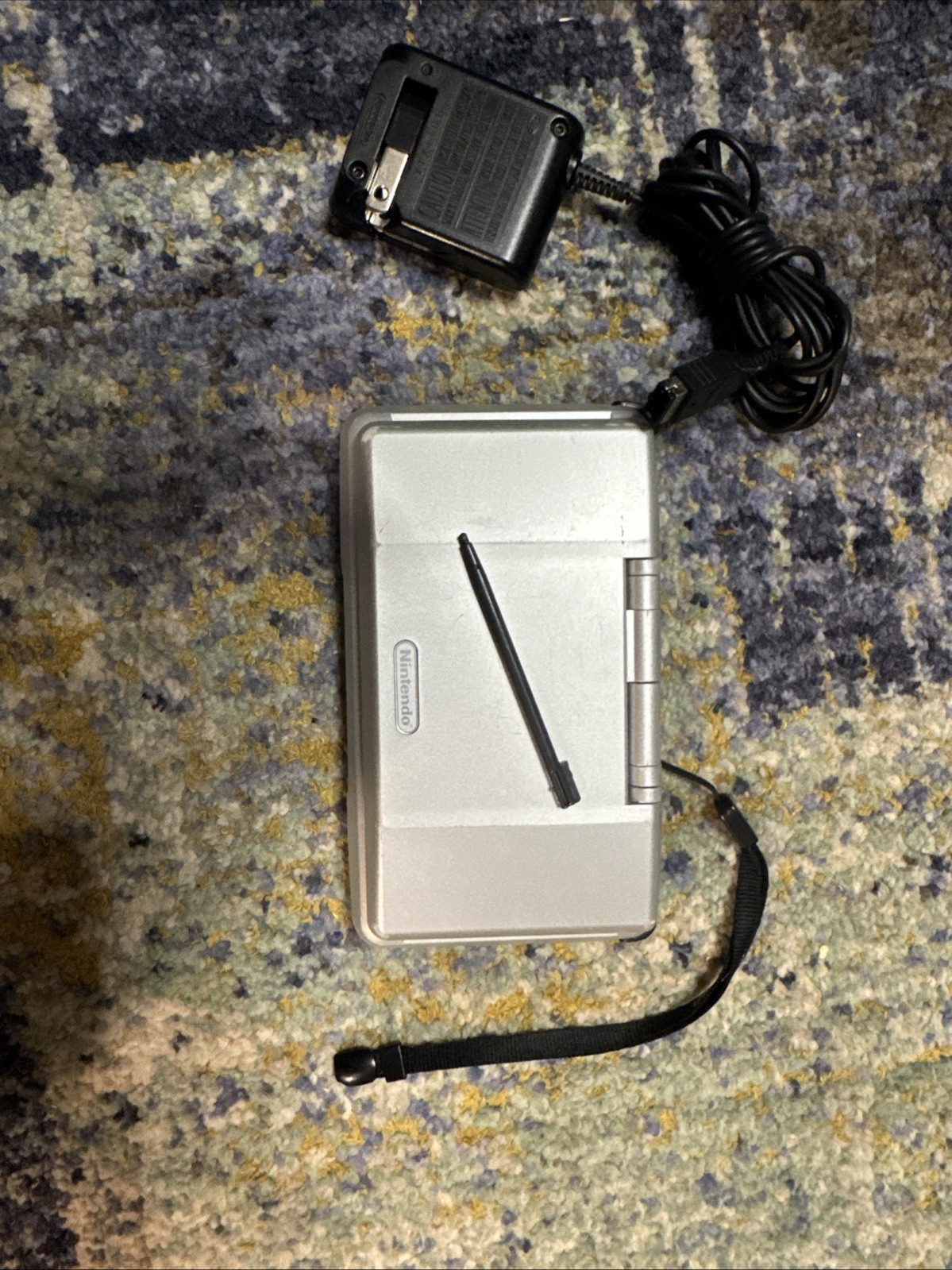 Nintendo DS Handheld System Silver with original wrist strap, stylus and charger