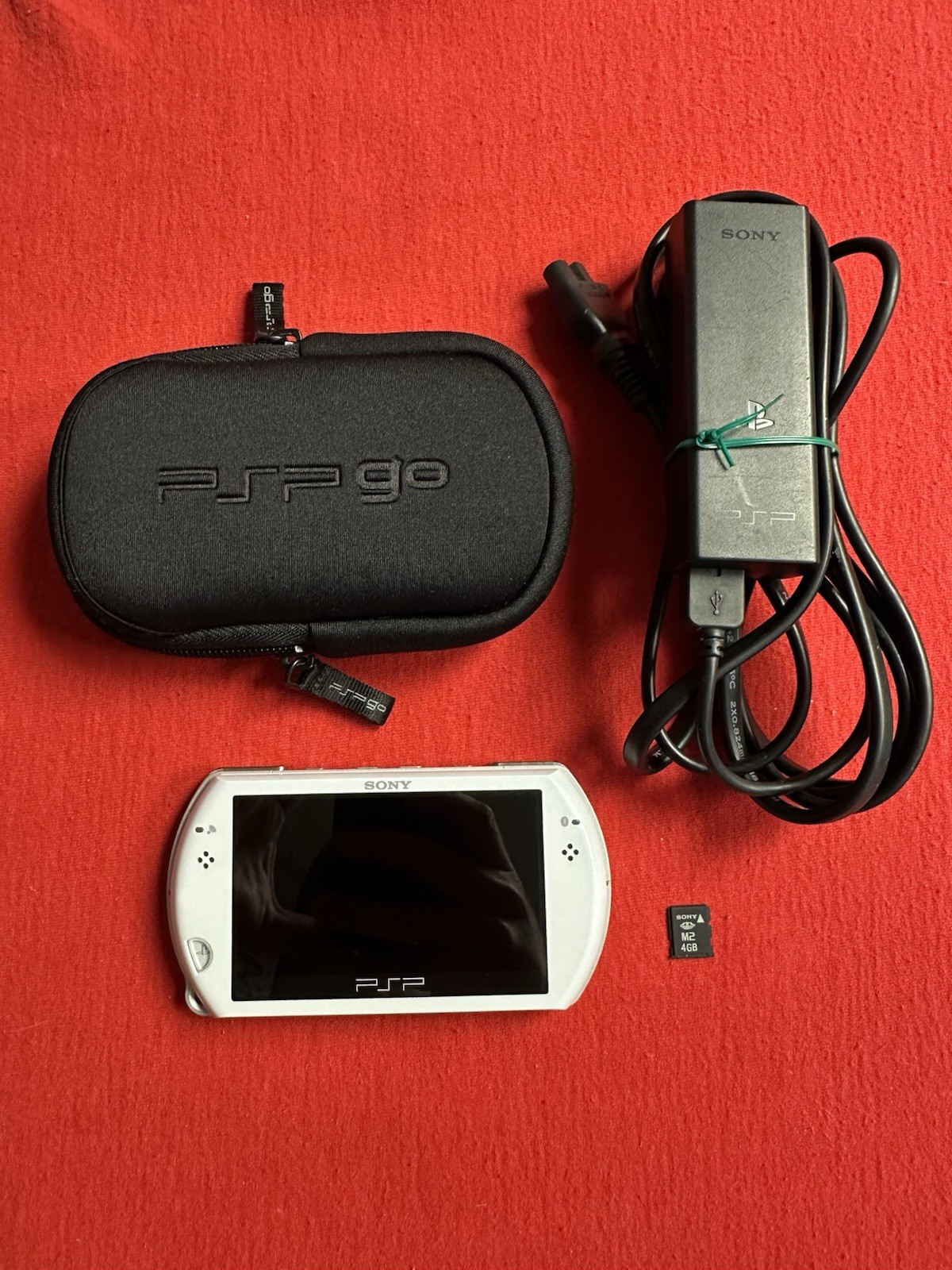 Sony PSP Go 16GB Handheld System – Pearl White – Charger & Case