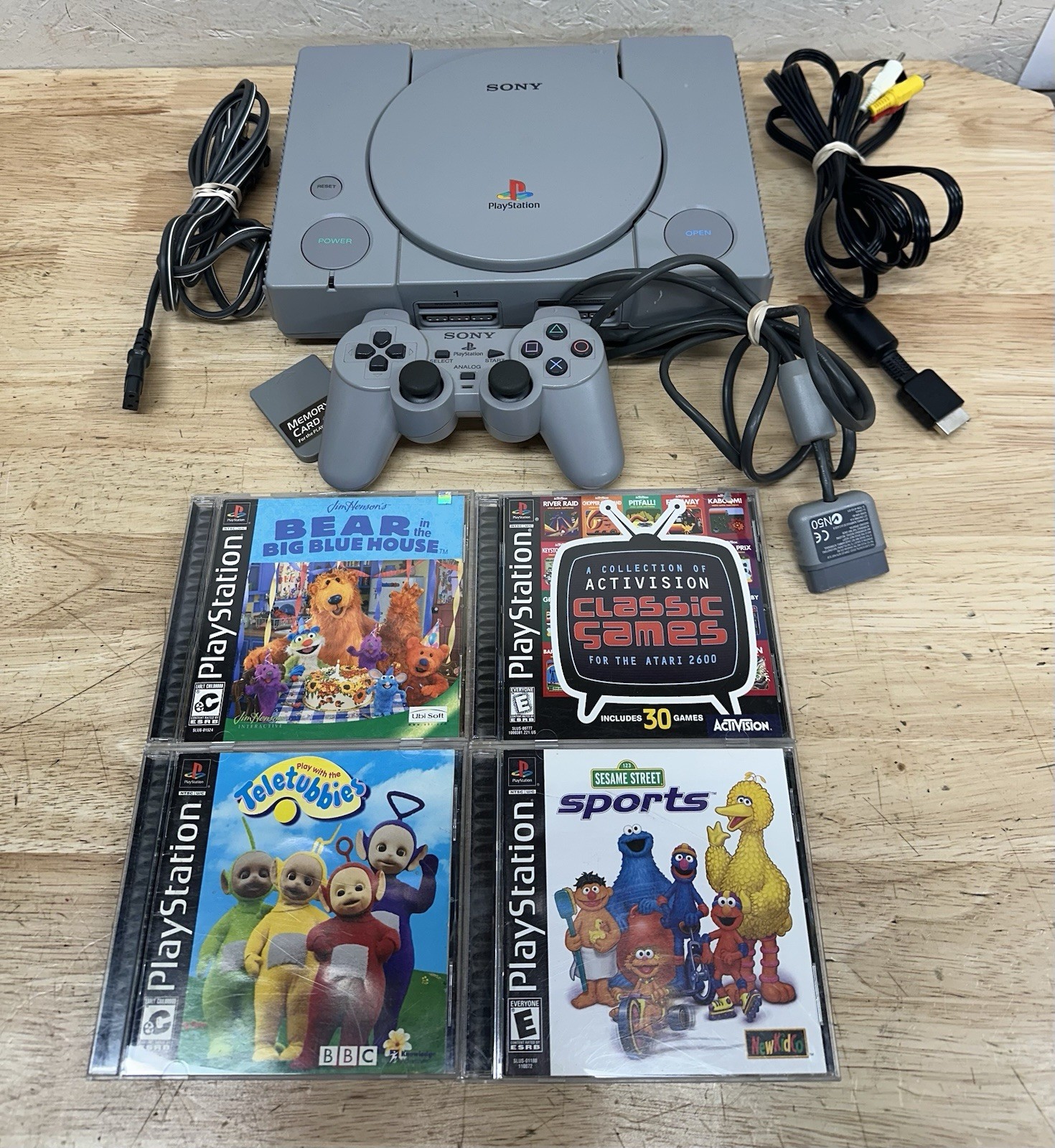 Sony PlayStation Console with DualShock Controllers Cables 4 Games SCPH-7501