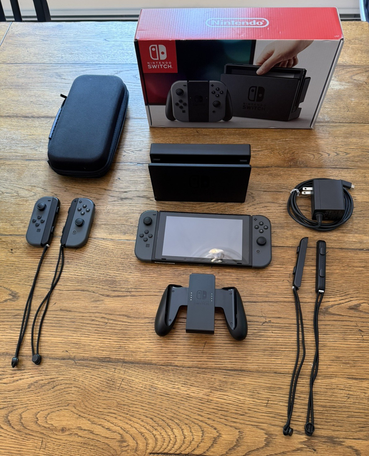 Nintendo Switch with extra joy-cons, dock, holder, case, charger, SD, and box