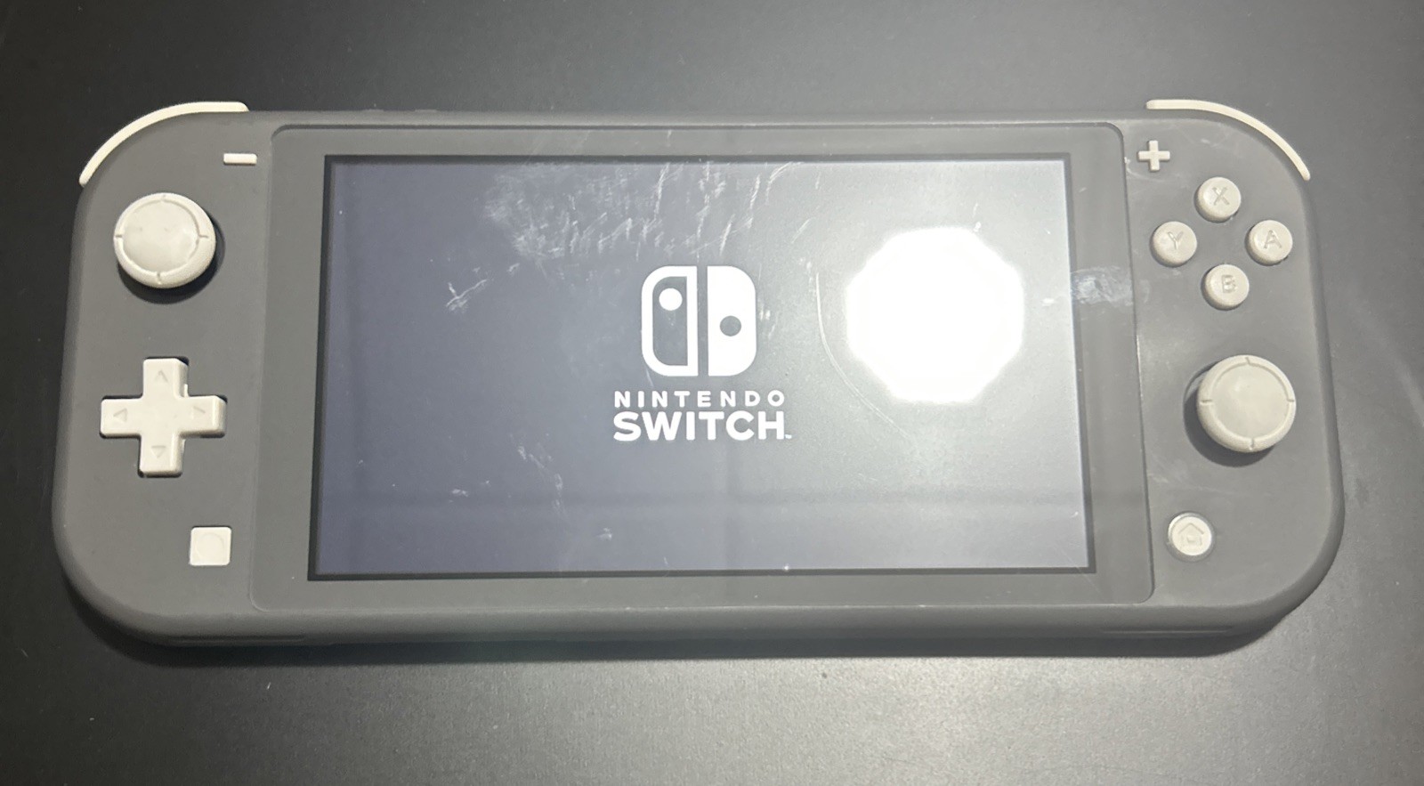 Nintendo Switch Lite – Gray (light scratches on screen)