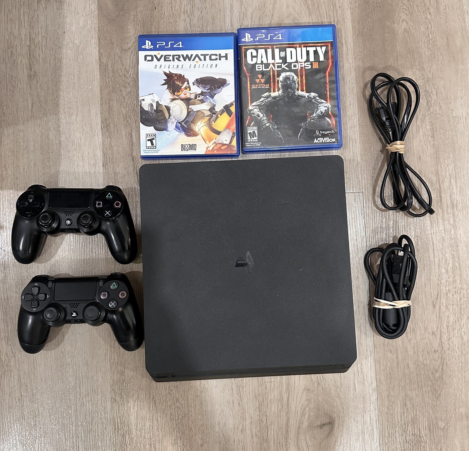 Sony PS4 Console 1TB Slim – FW 9.6 – HDMI/Power Cables and 2 Controllers Bundle