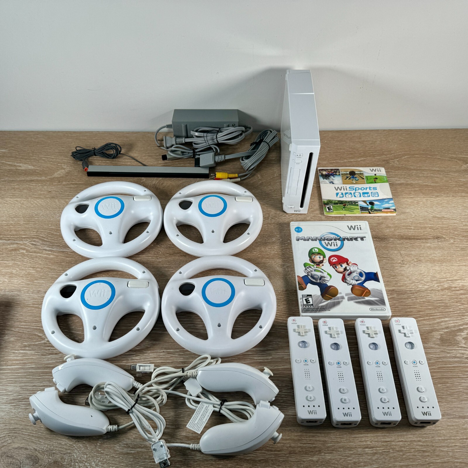 Nintendo Wii Console Mario Kart Bundle with Wii Sports, 4 Controllers & 4 Wheels