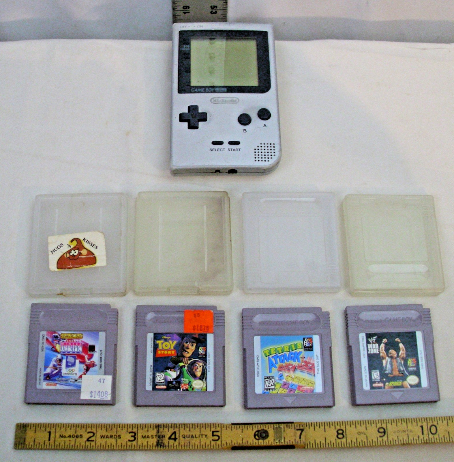 NINTENDO GAME BOY POCKET MODEL NO. MGB-001 WITH FOUR GAMES