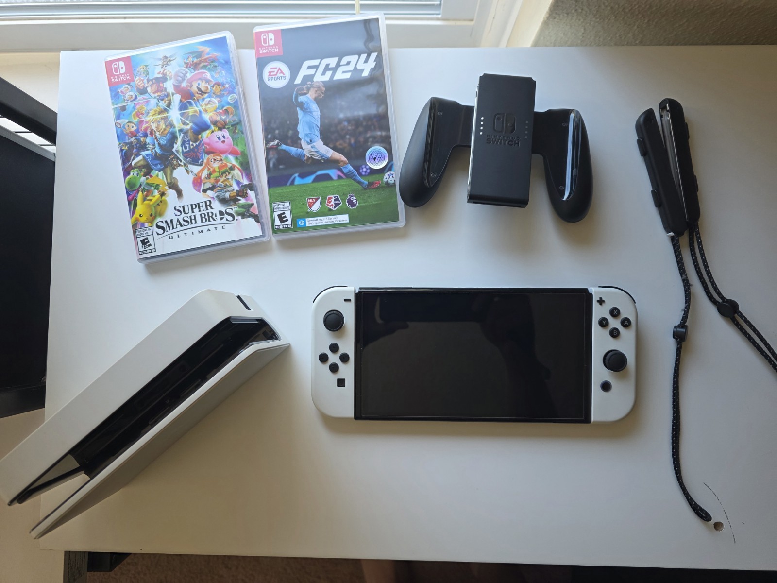 Nintendo Switch OLED White Console with Super Smash Bros. Ultimate & FC24 Games