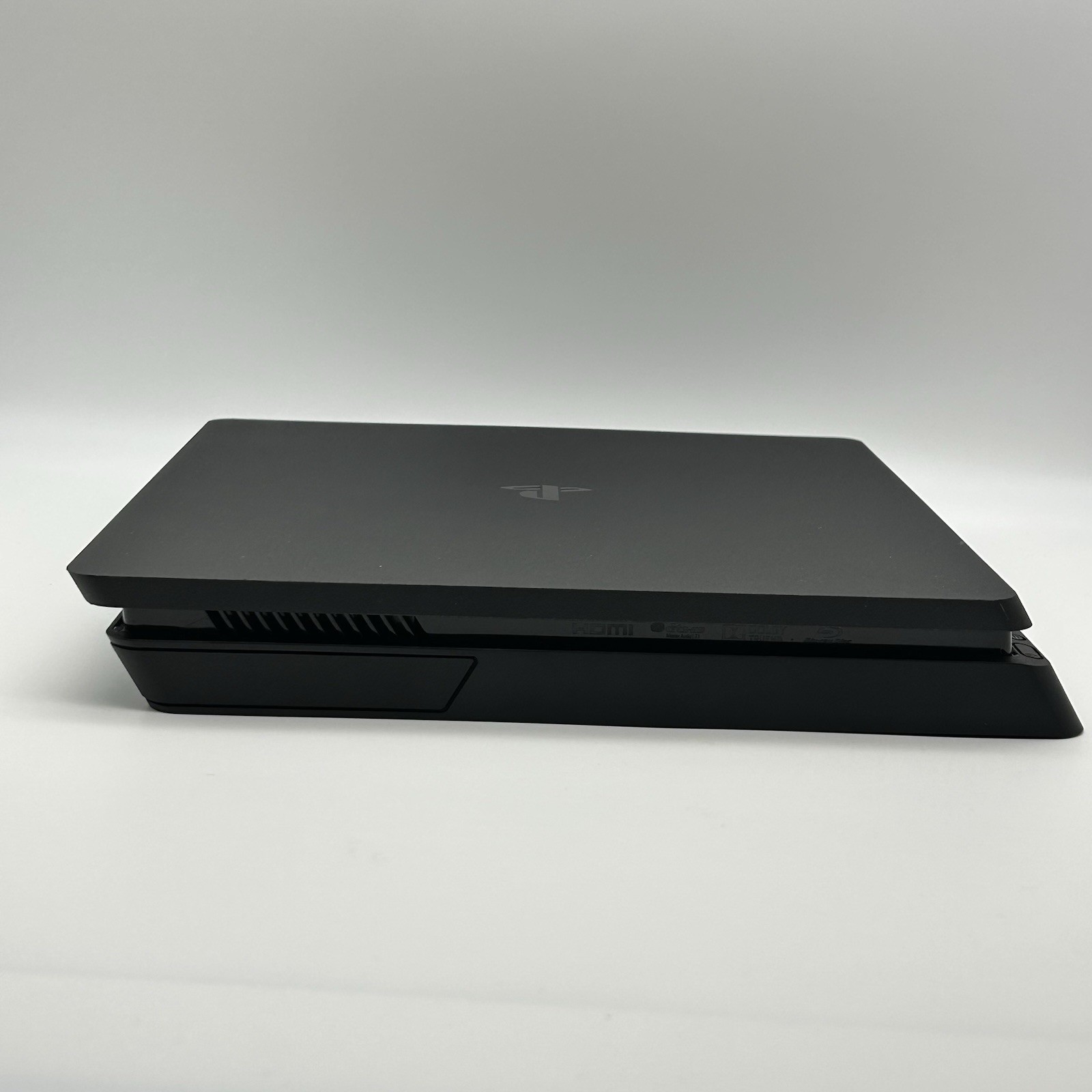 Sony PS4 Slim 1TB Console Bundle [Includes 2 Controllers, Power Cord, HDMI Cord]