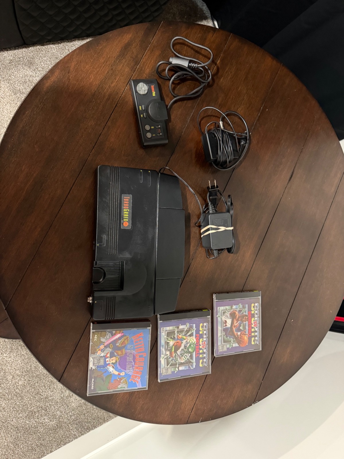 turbo grafx 16 console, control, power supply and games.
