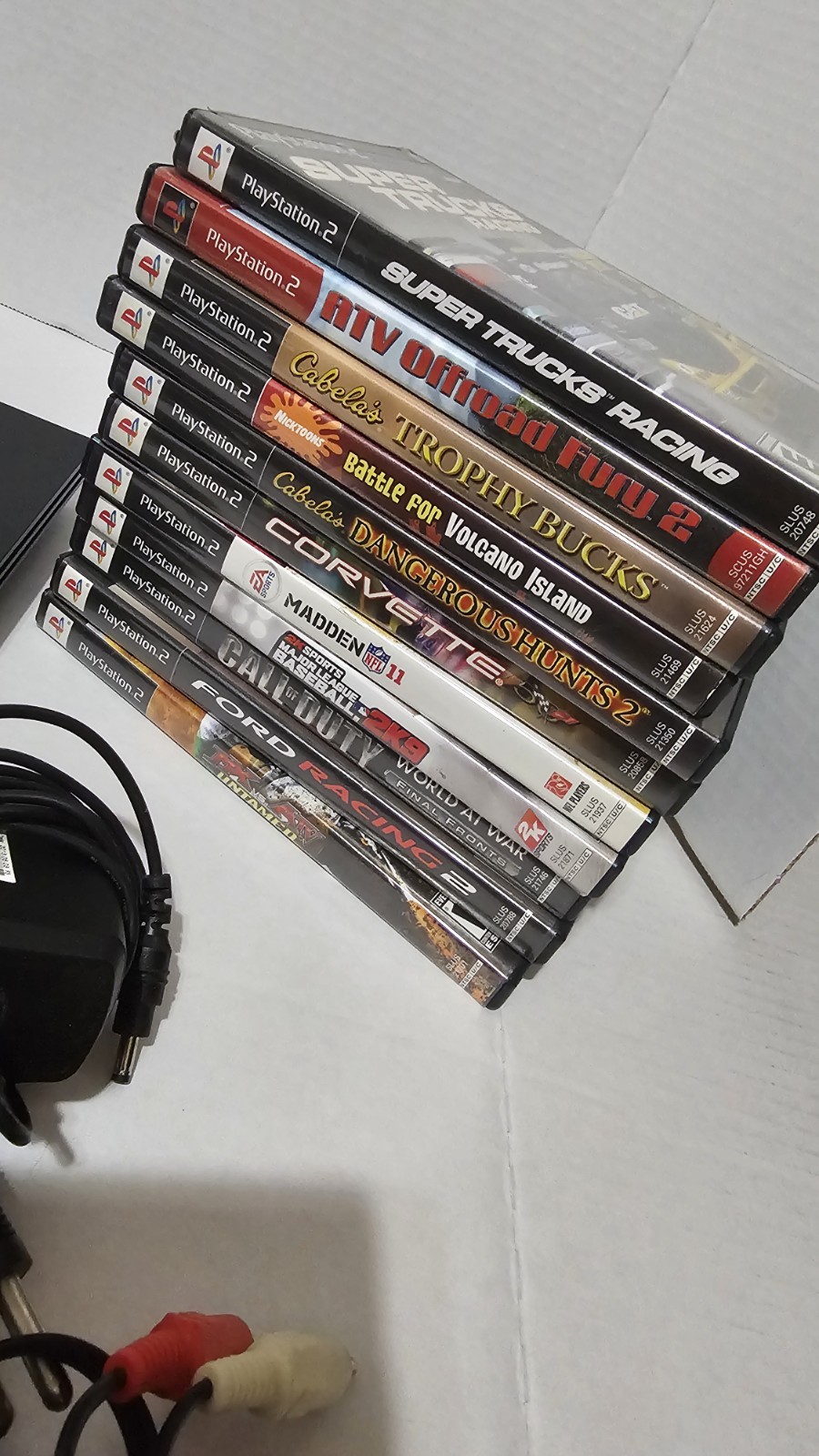 PlayStation 2 Slim with 4Controllers – Cords 8gb Memory Card And 11 Games.