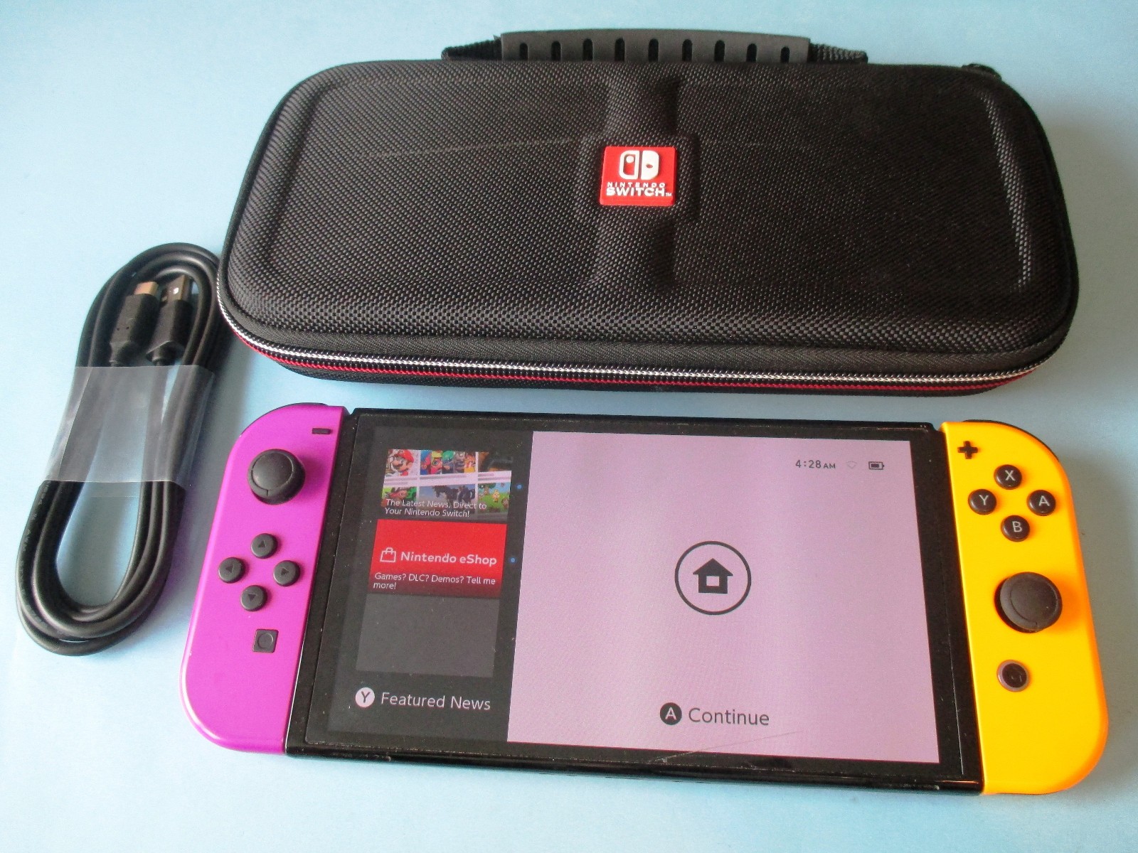 Nintendo Switch OLED System Black Console w/Purple & Orange Joy-Cons + Case