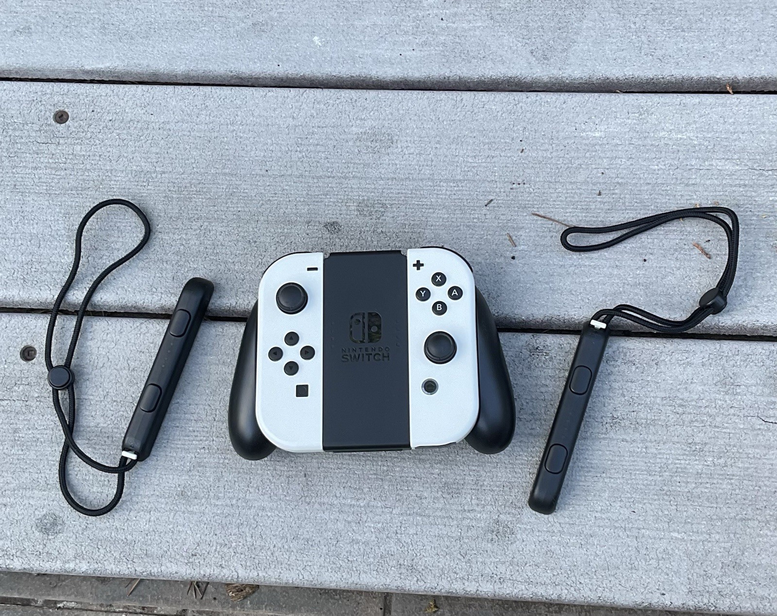 White Joycons with Straps And Grip. OLED White Nintendo Joycons