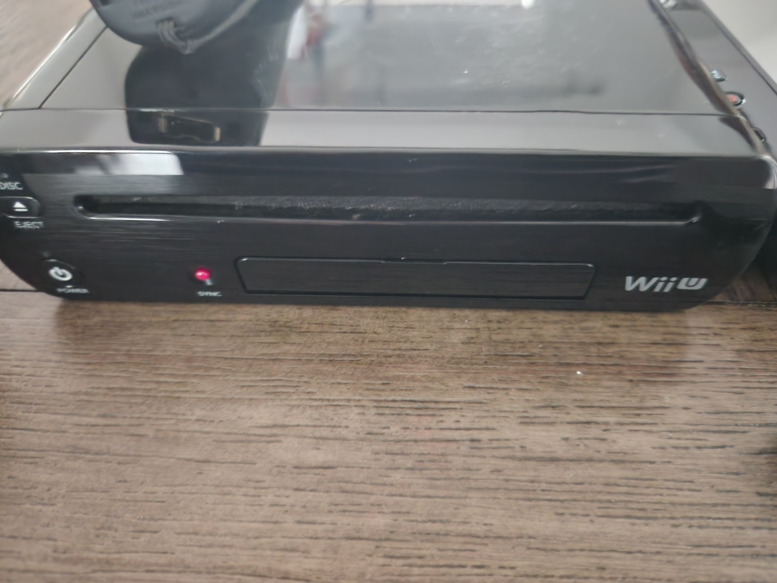 Nintendo Wii U Black Console w/ GamePad, 1 Wii Remotes, & 4 Games