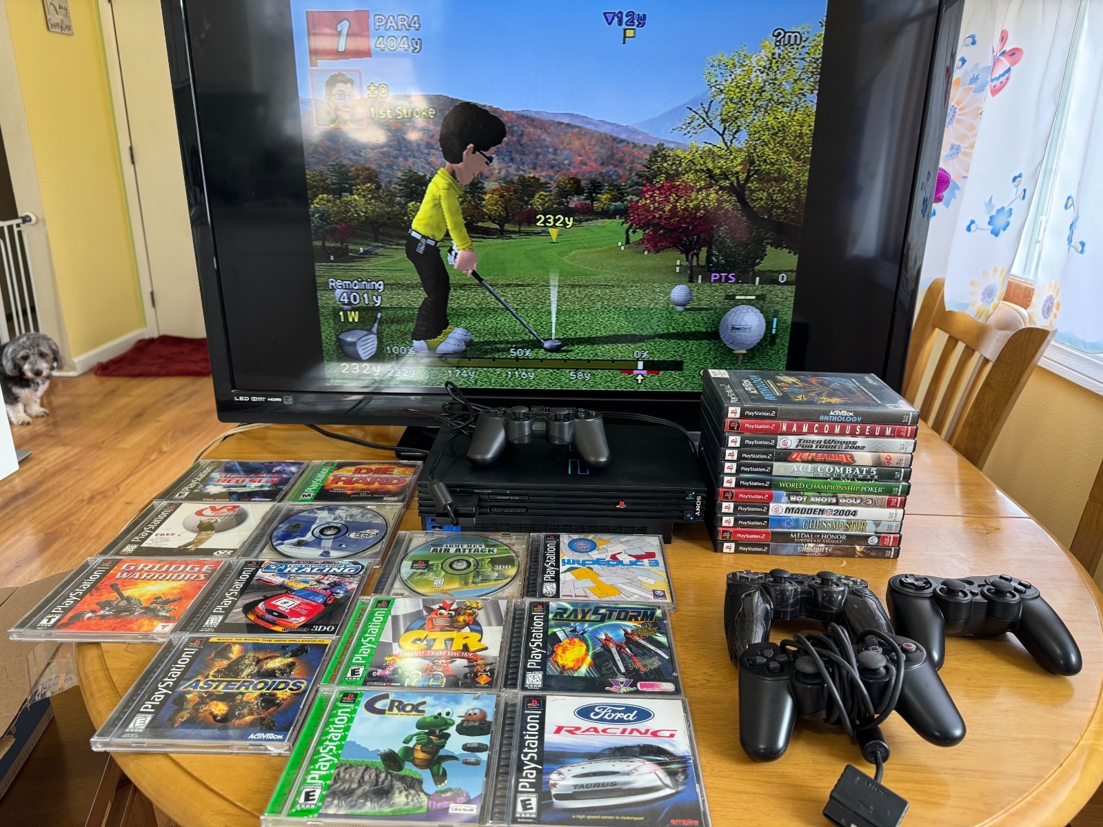 Playstation 2 console package with 13 PS 1 games and 11 PS 2 games. Lightly used