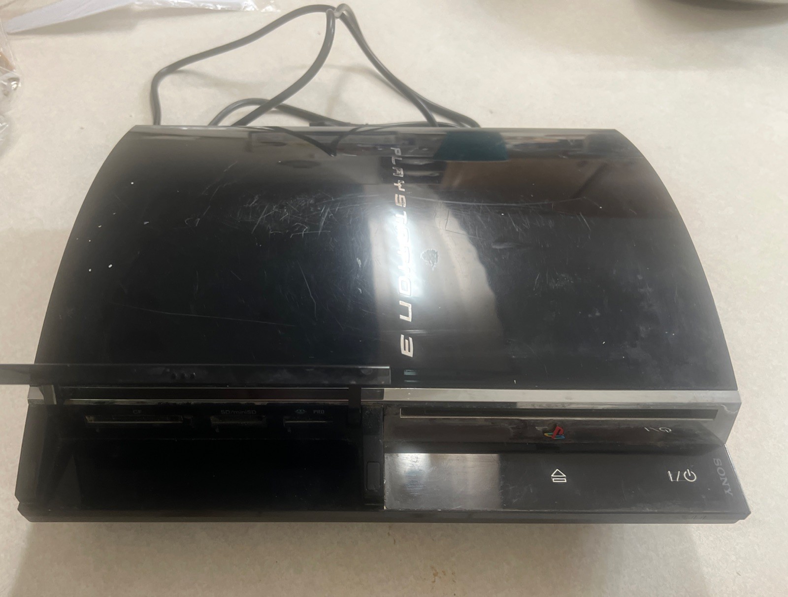 Sony PlayStation 3 60GB Piano Console – Black Backwards Compatible