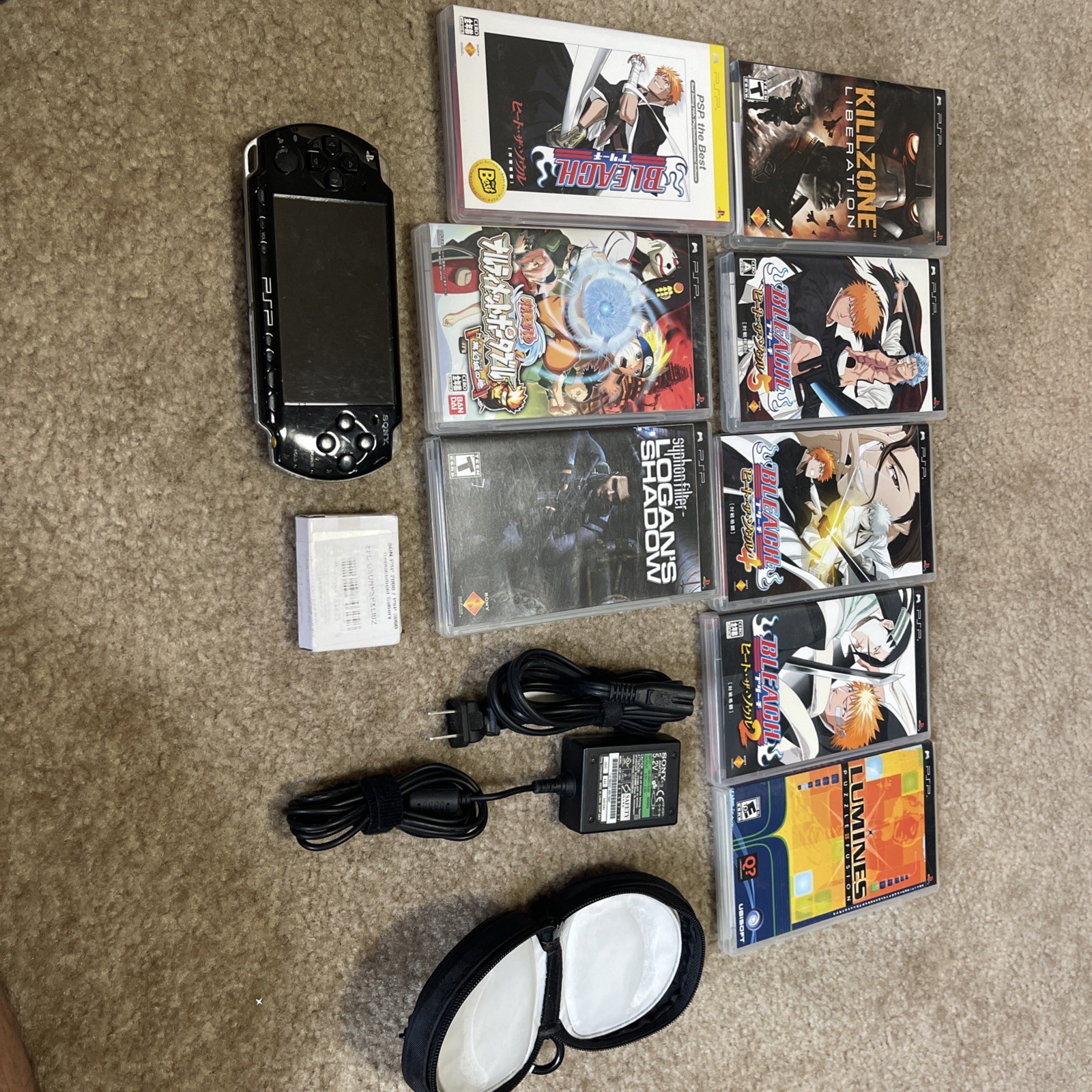 SonyPSP 2001 PlayStation Portable Handheld Console w/8 Games Game Case & Charger