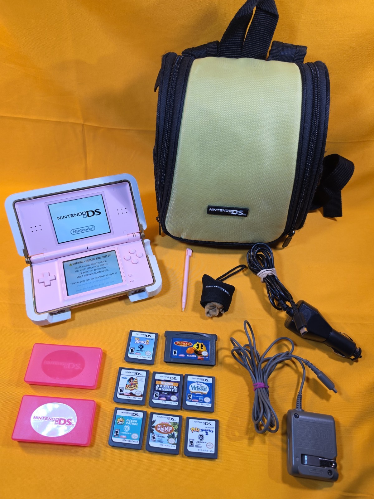 Nintendo DS Lite Console USG-001 w/ Charger & Case – Coral Pink – Read
