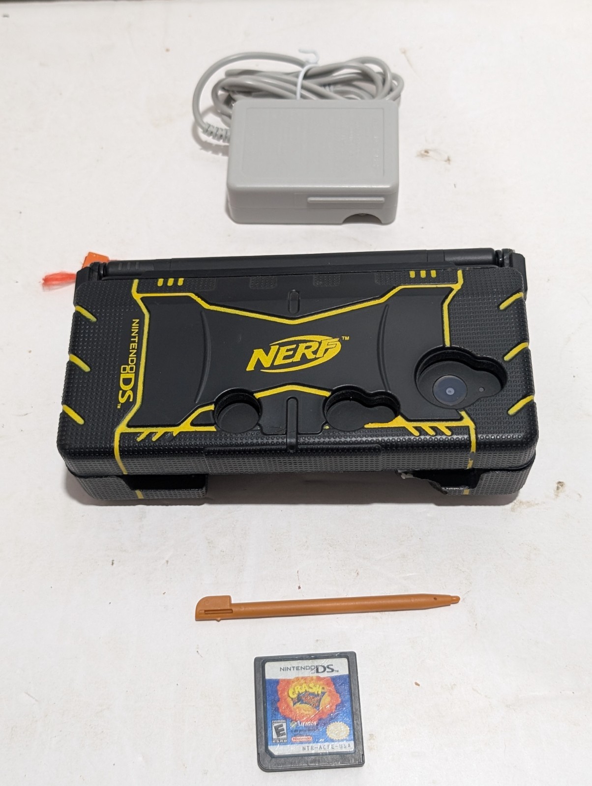 Nintendo DSi Bundle (DSi + NERF Case + Charger + Stylus + Game)