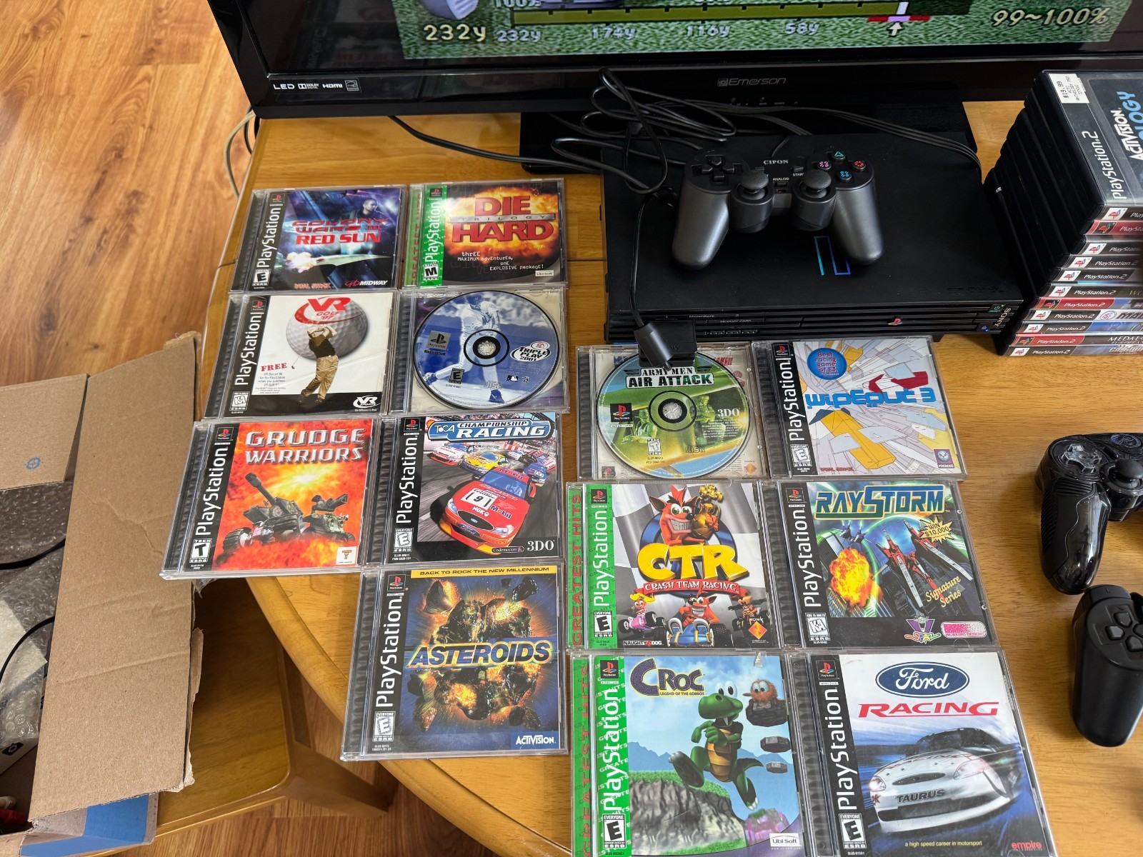 Playstation 2 console package with 13 PS 1 games and 11 PS 2 games. Lightly used