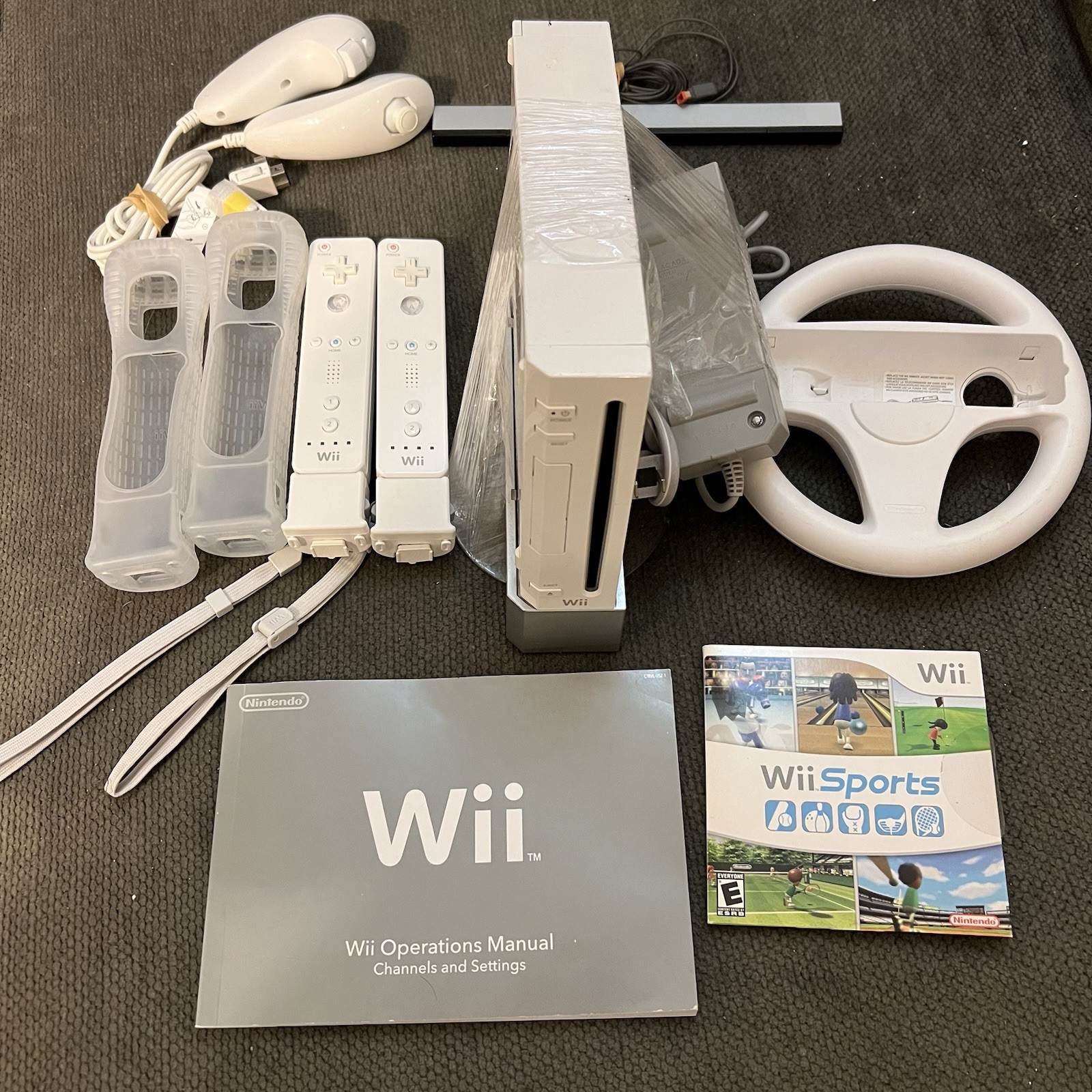 Nintendo Wii Console Bundle w/ Wii Sports, 2 Remotes, Nunchuks, Wheel & Manuals