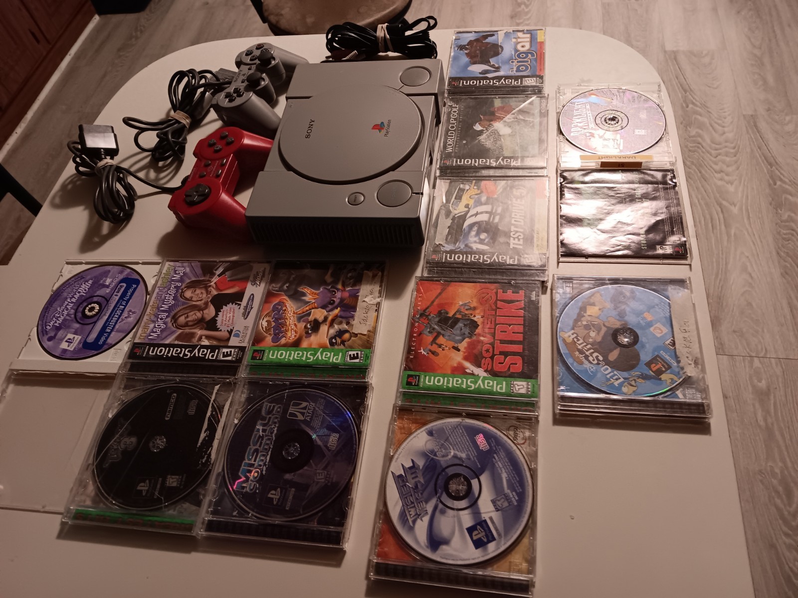 Vintage Sony Playstation 1 Console With Cords, 2 Controllers And 12 Games