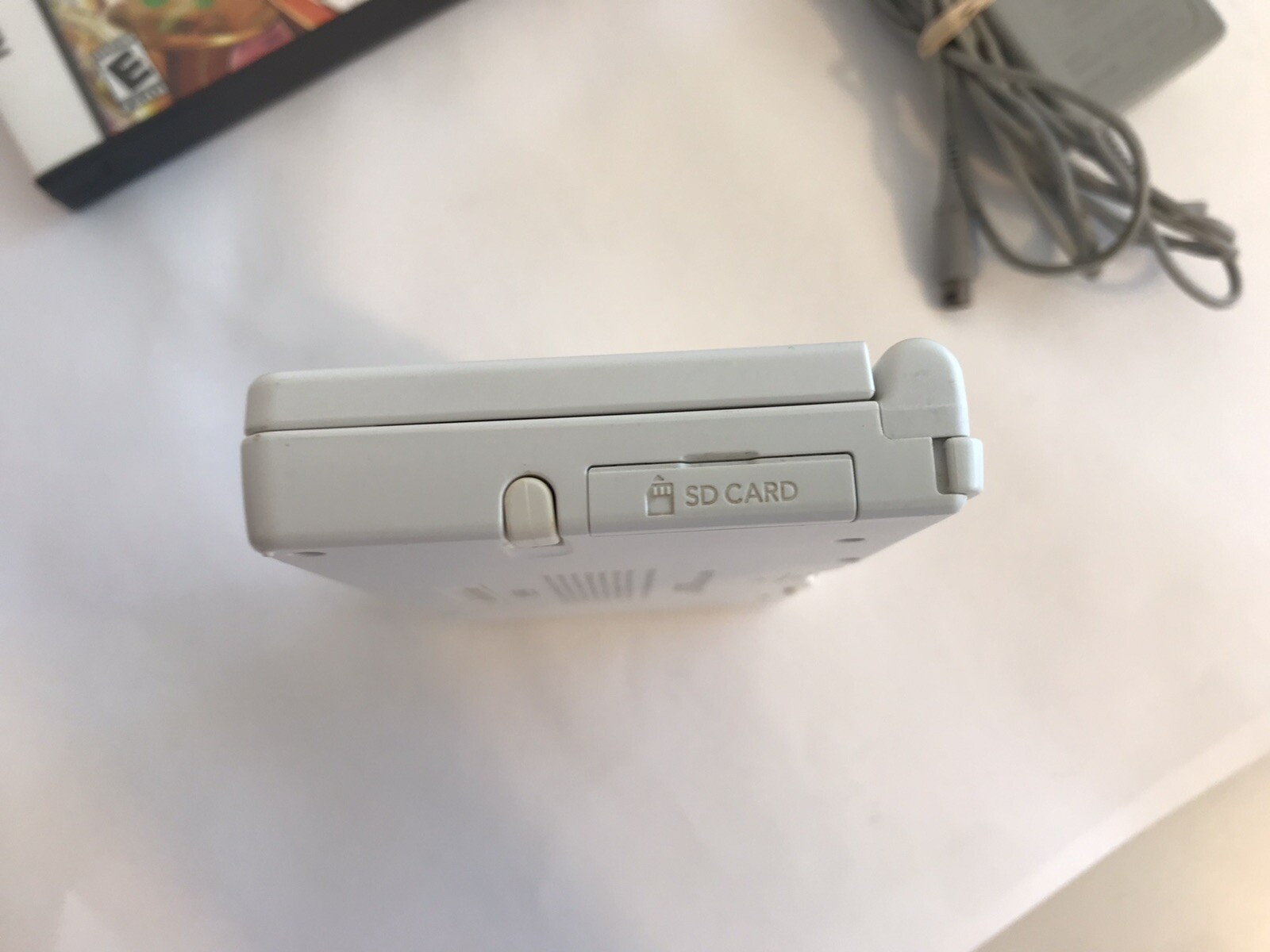 Nintendo DSi Handheld Game Console – White- with charger and 8 games