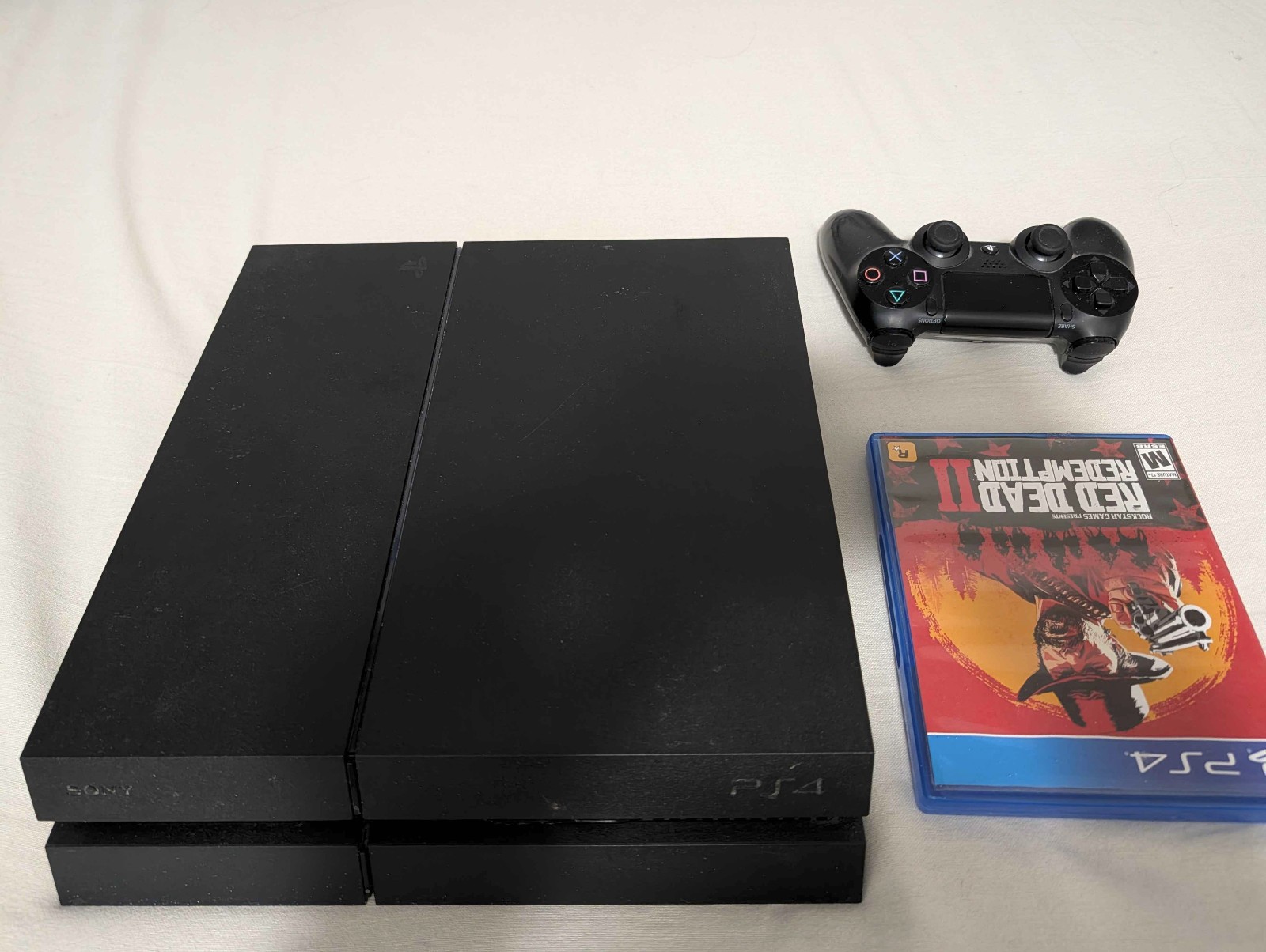 Sony PlayStation 4 w/ controller and game