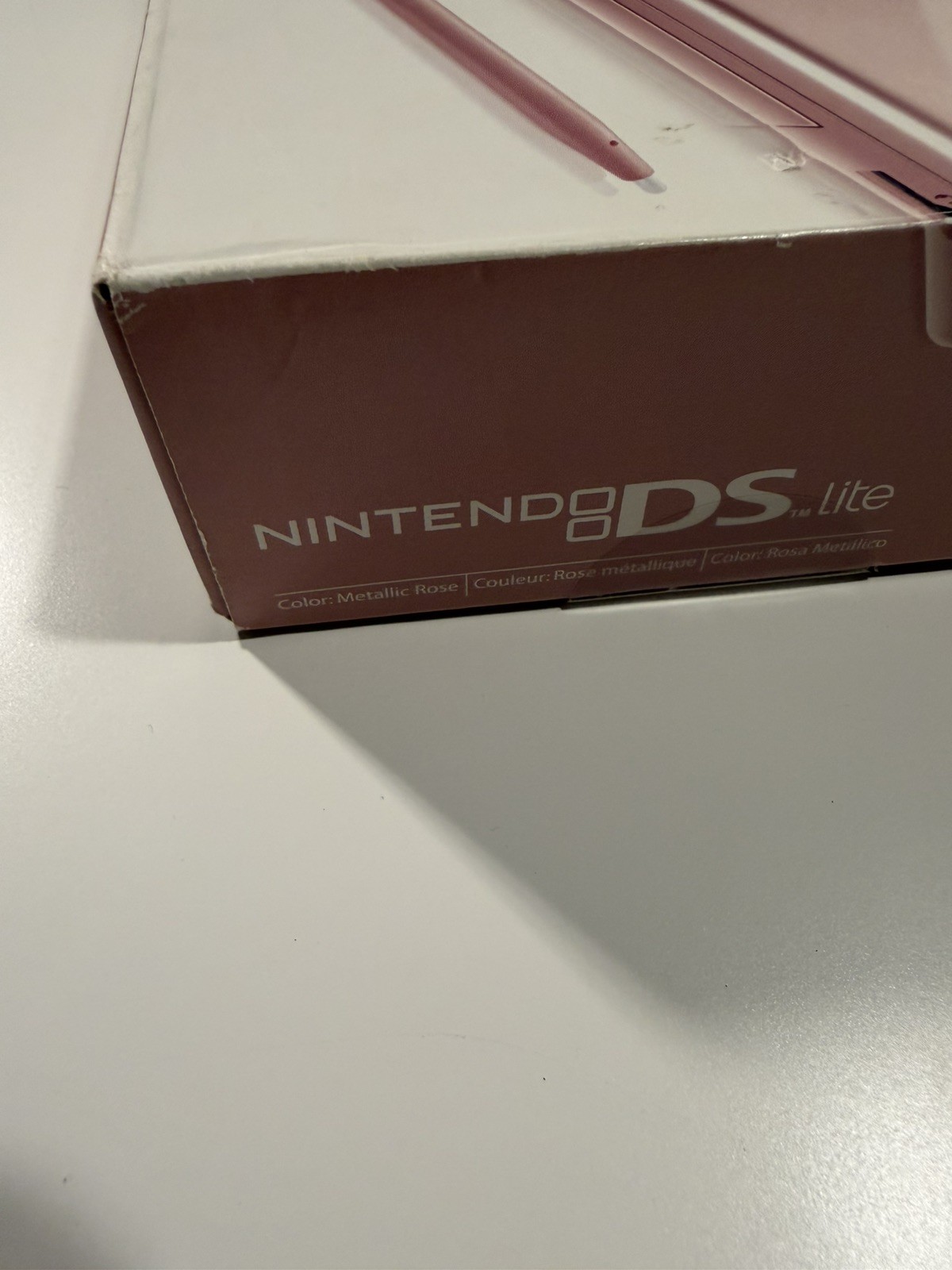 Nintendo DS Lite Metallic Rose System With Charger, Original Box, And 2 Cases