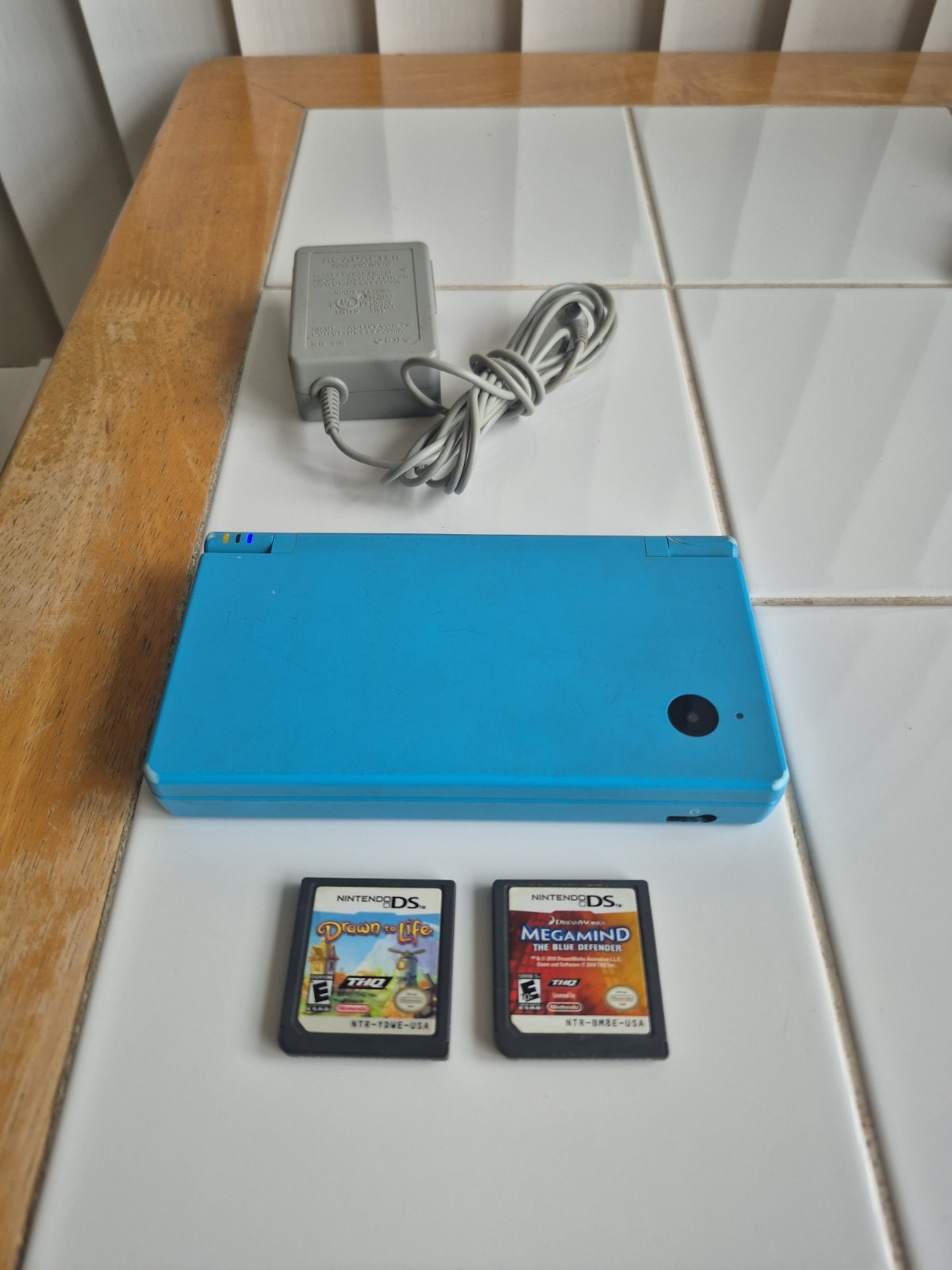 Nintendo DSi Light Blue Handheld System And Bundle Games