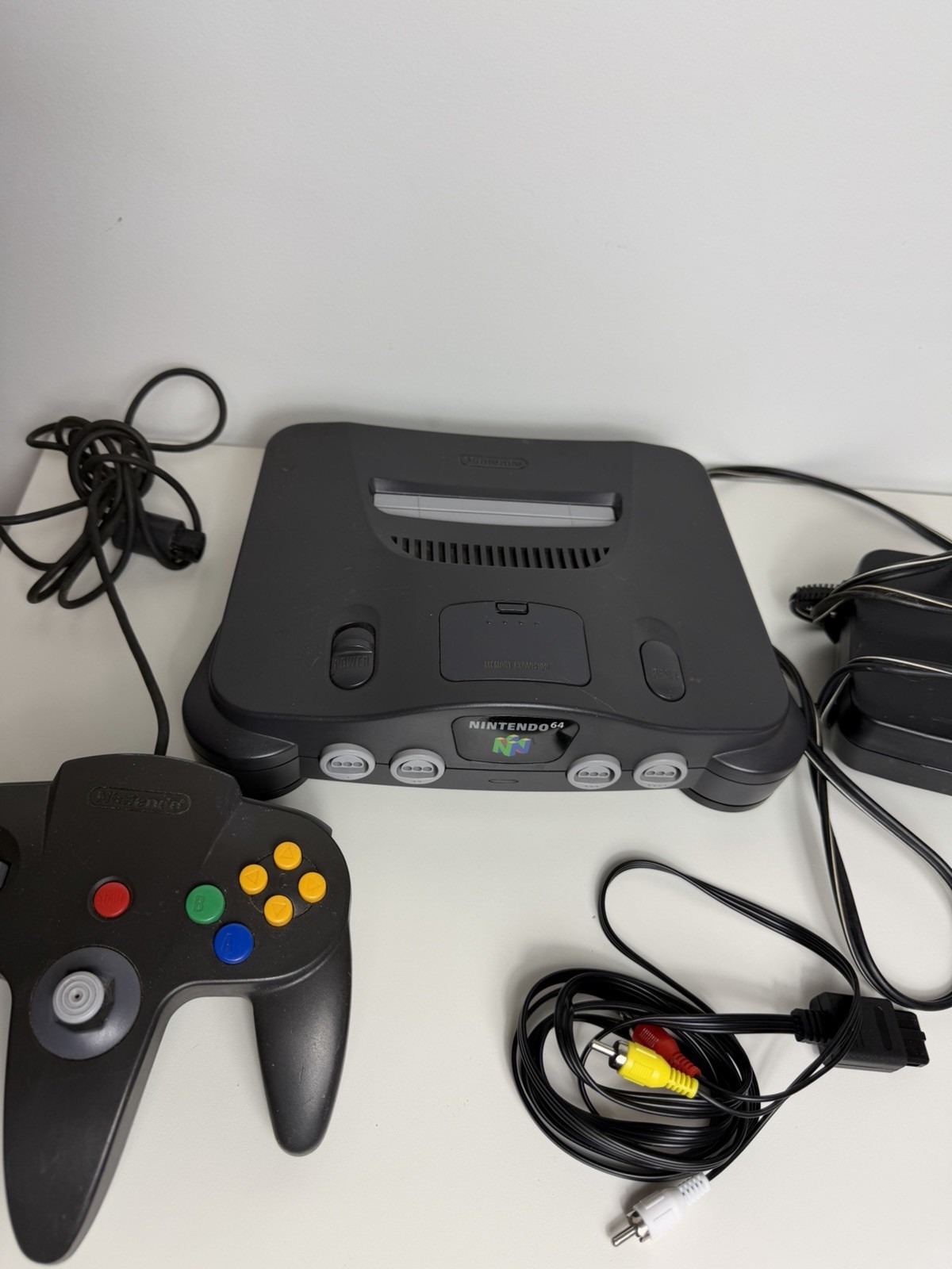 Nintendo 64- Black Working Great. Comes With Cables And 1 OEM Controller