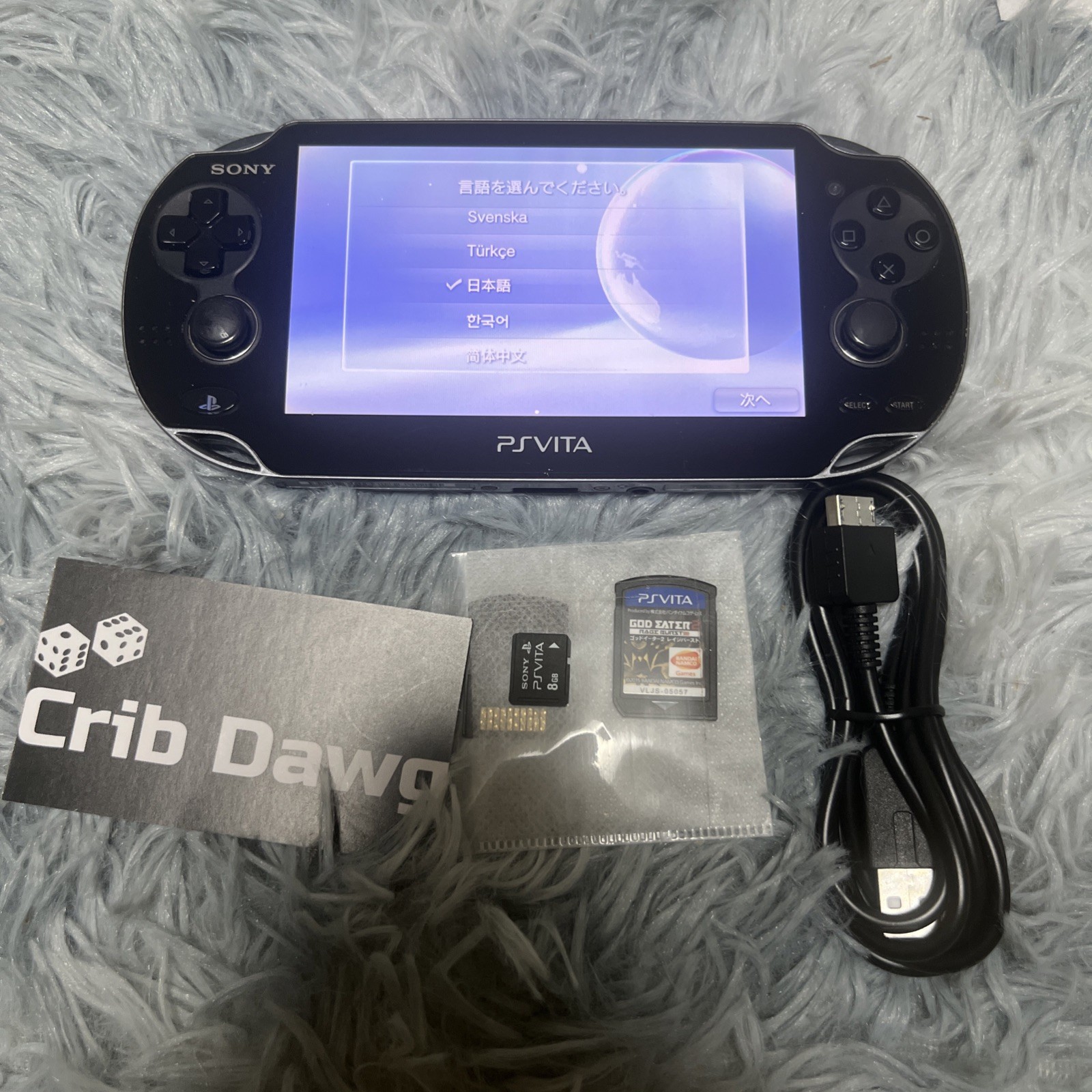 Sony PlayStation Vita Handheld System + 8GB memory card + 2 software & charger