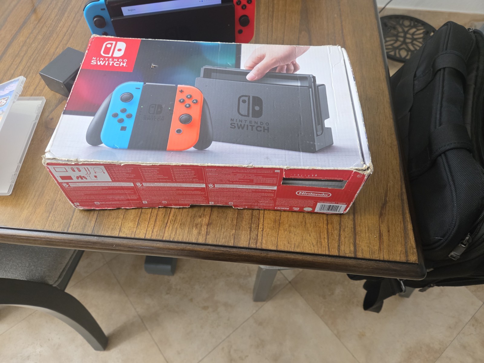 Nintendo Switch Console with Neon Red and Blue Joy-Cons, Plus Games
