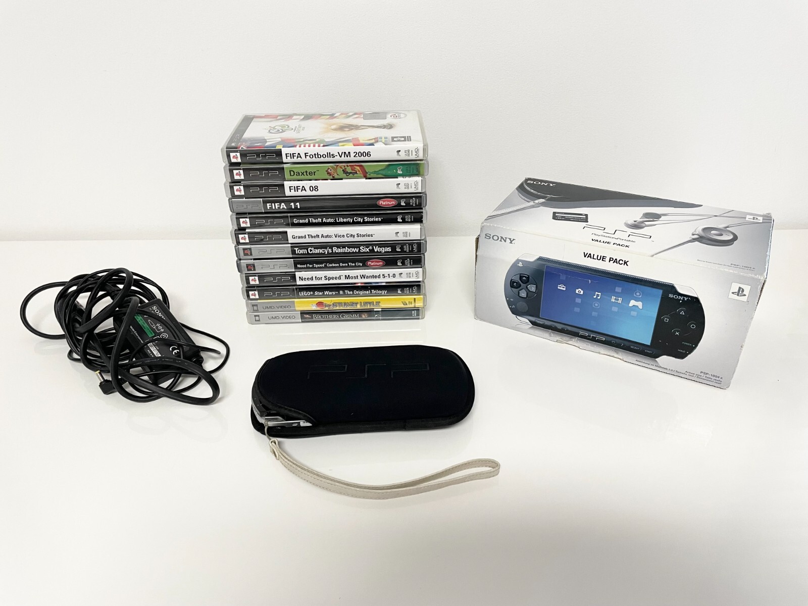 Sony PlayStation Portable Value Pack – Black (PSP-1001K) with 12 games/movies