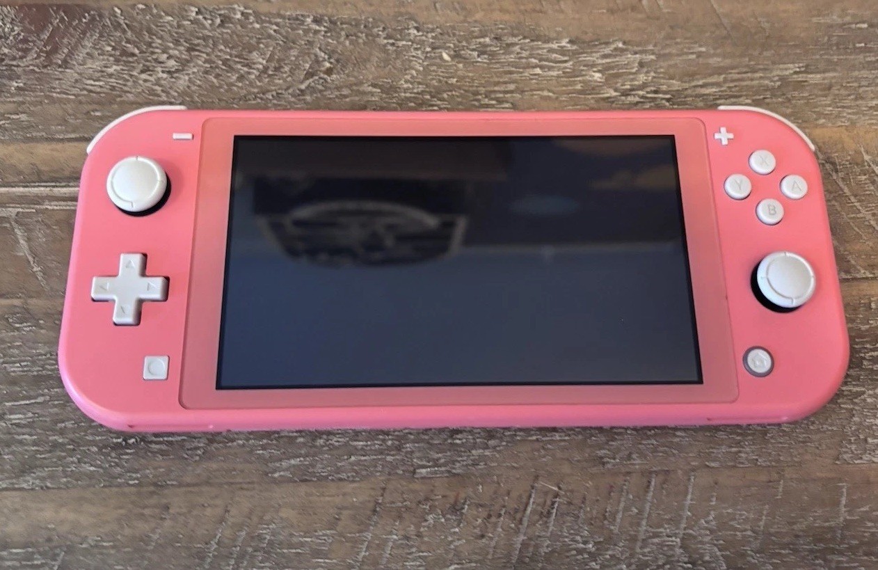 Nintendo Switch Lite Coral Pink Console w/ Luigi’s Mansion 3, Charger, Case