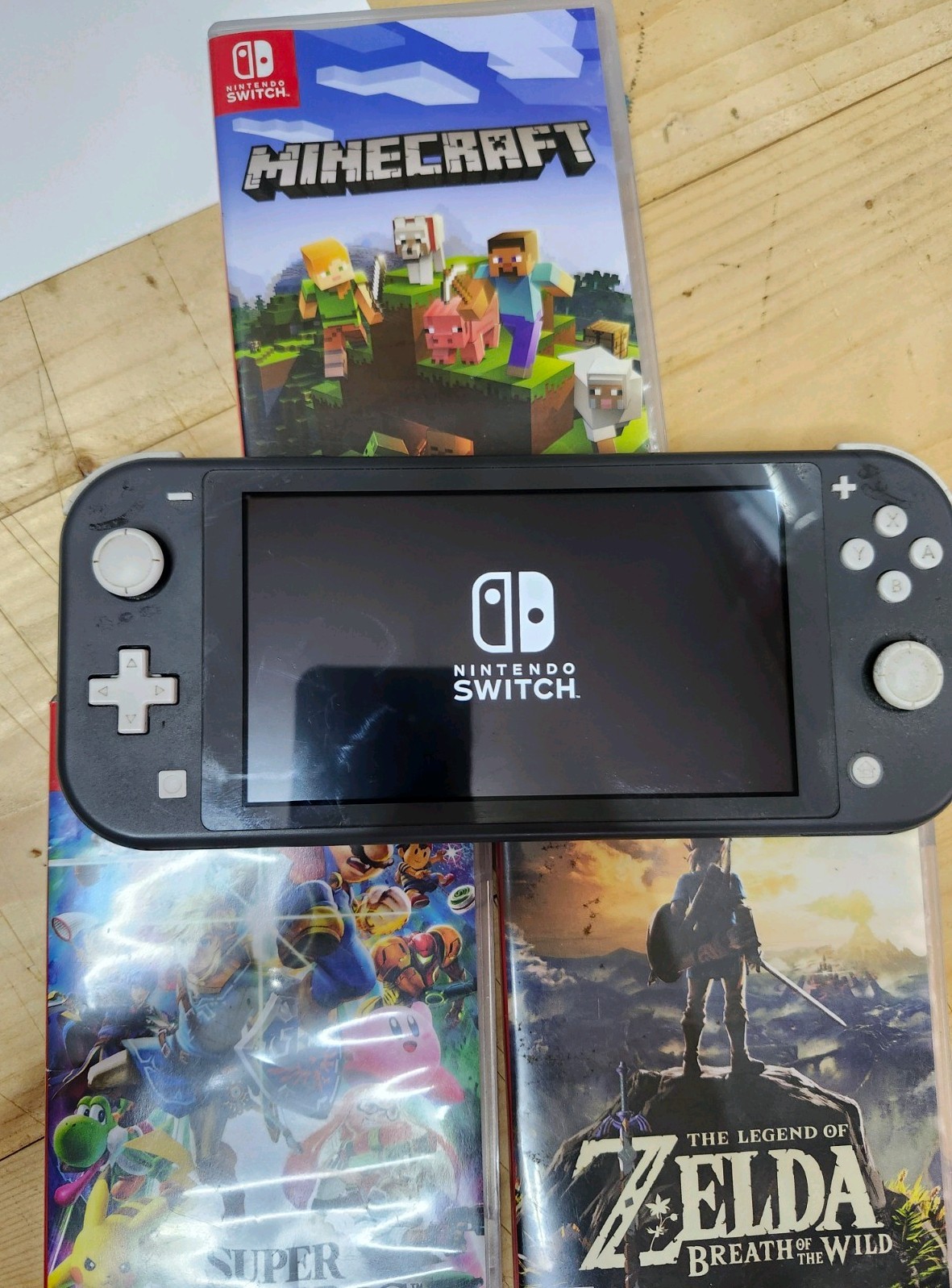Nintendo Switch Lite Gray With Three Games Zelda Smash Bros Minecraft WORKING