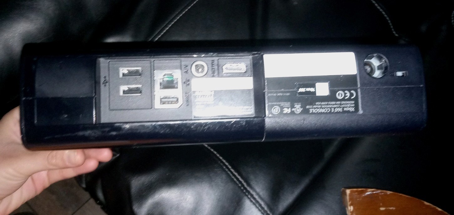 Black Microsoft Xbox 360 E Console With White Controller and AC Power Adapter