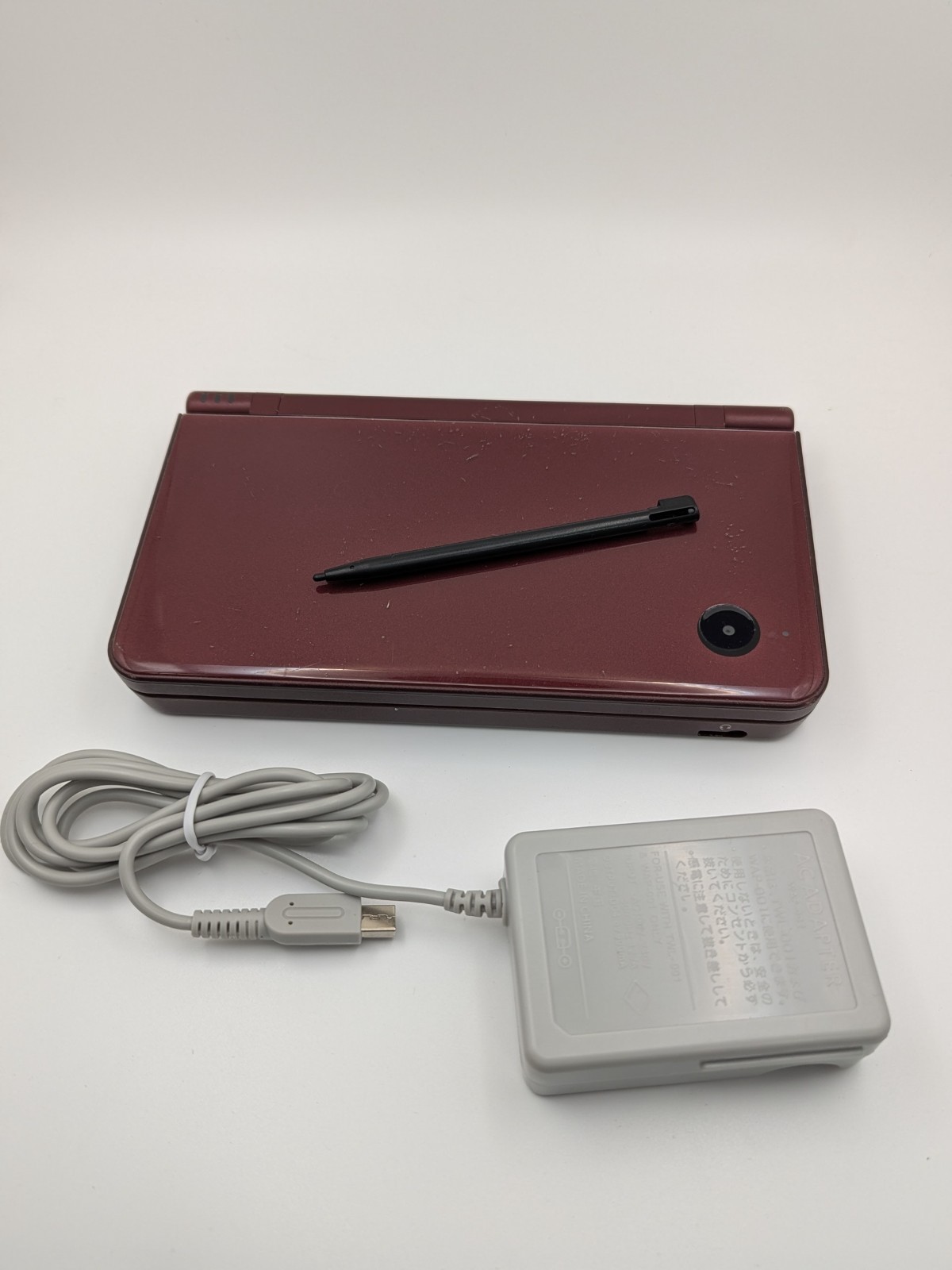 Nintendo DSi LL Burgundy Handheld Console With AC Adapter – working minor damage