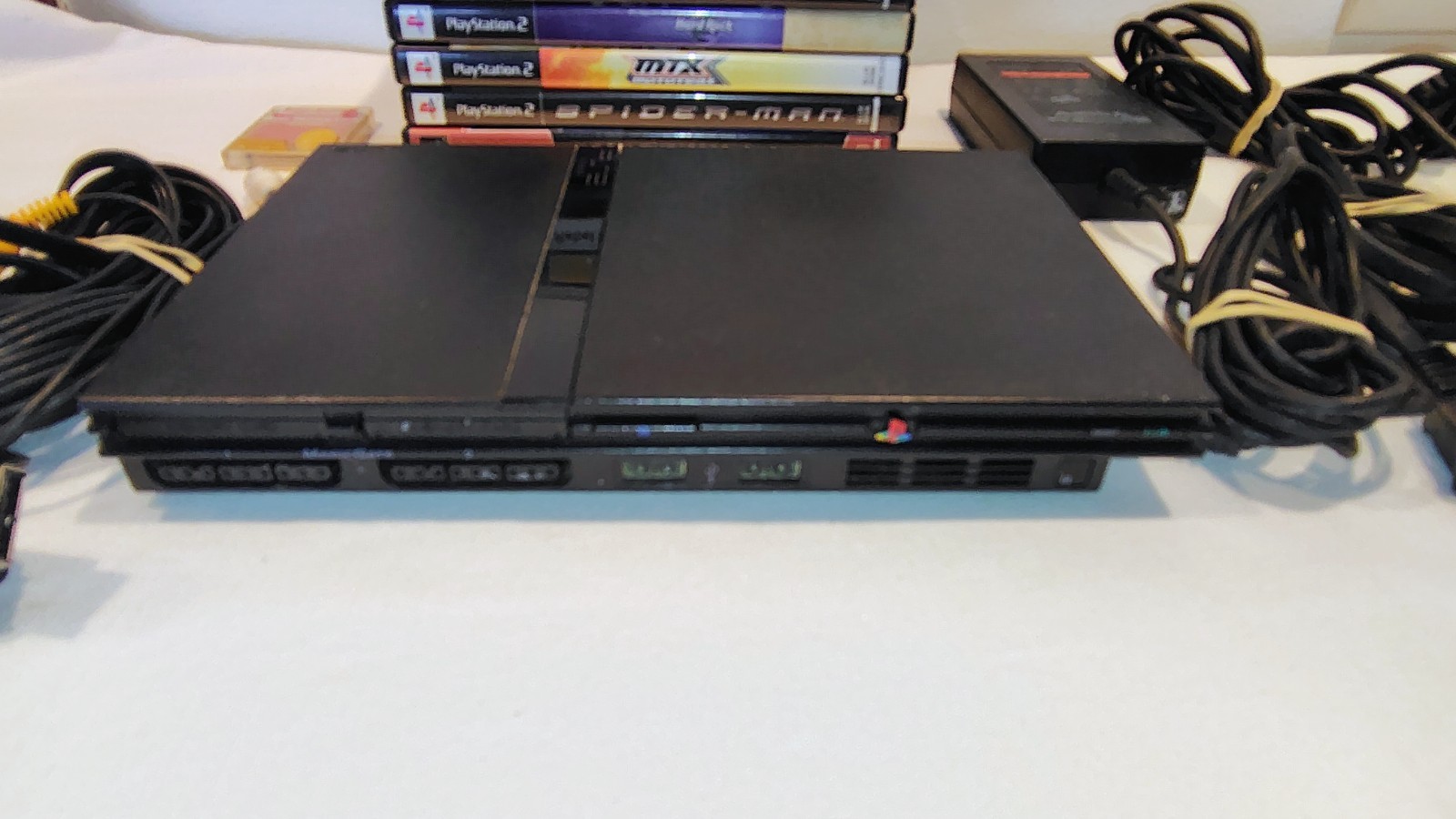 PS2 SLIM CONSOLE & ACCESSORIES W/MEMORY CARD/REMOTE & 6 GAMES – KINGDOM HEARTS +