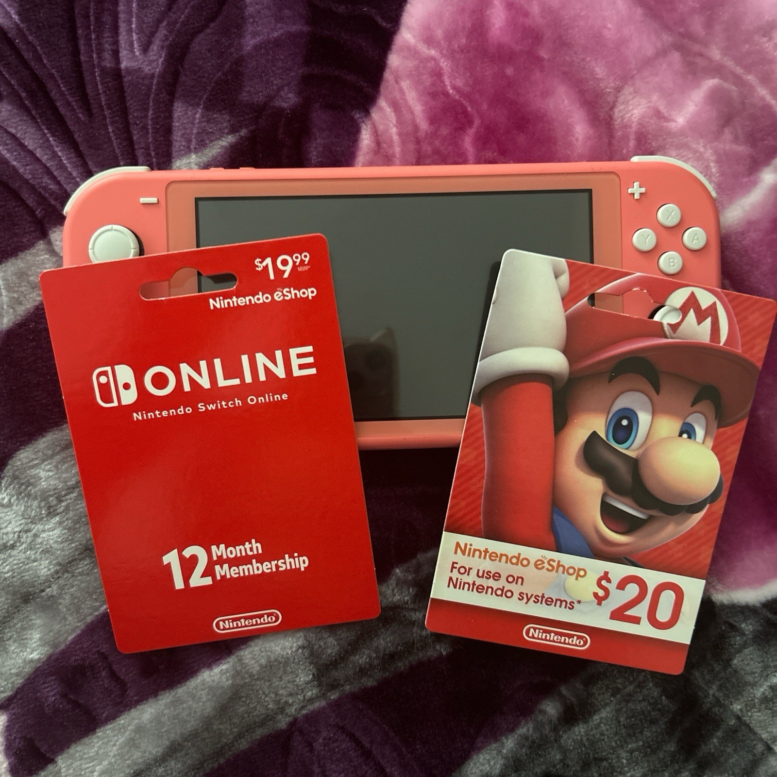 Nintendo Switch Lite Coral Console with eShop $20 Card & Switch Online 12 Month