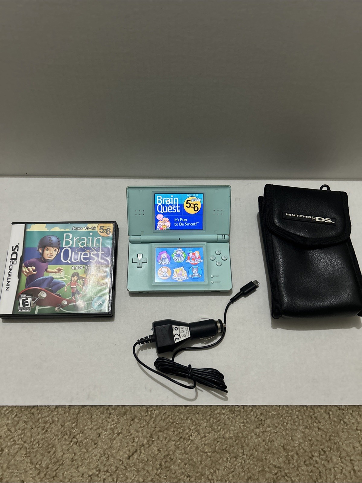 Nintendo DS Lite Light Blue Console Bundle with Game Charger And Case Read