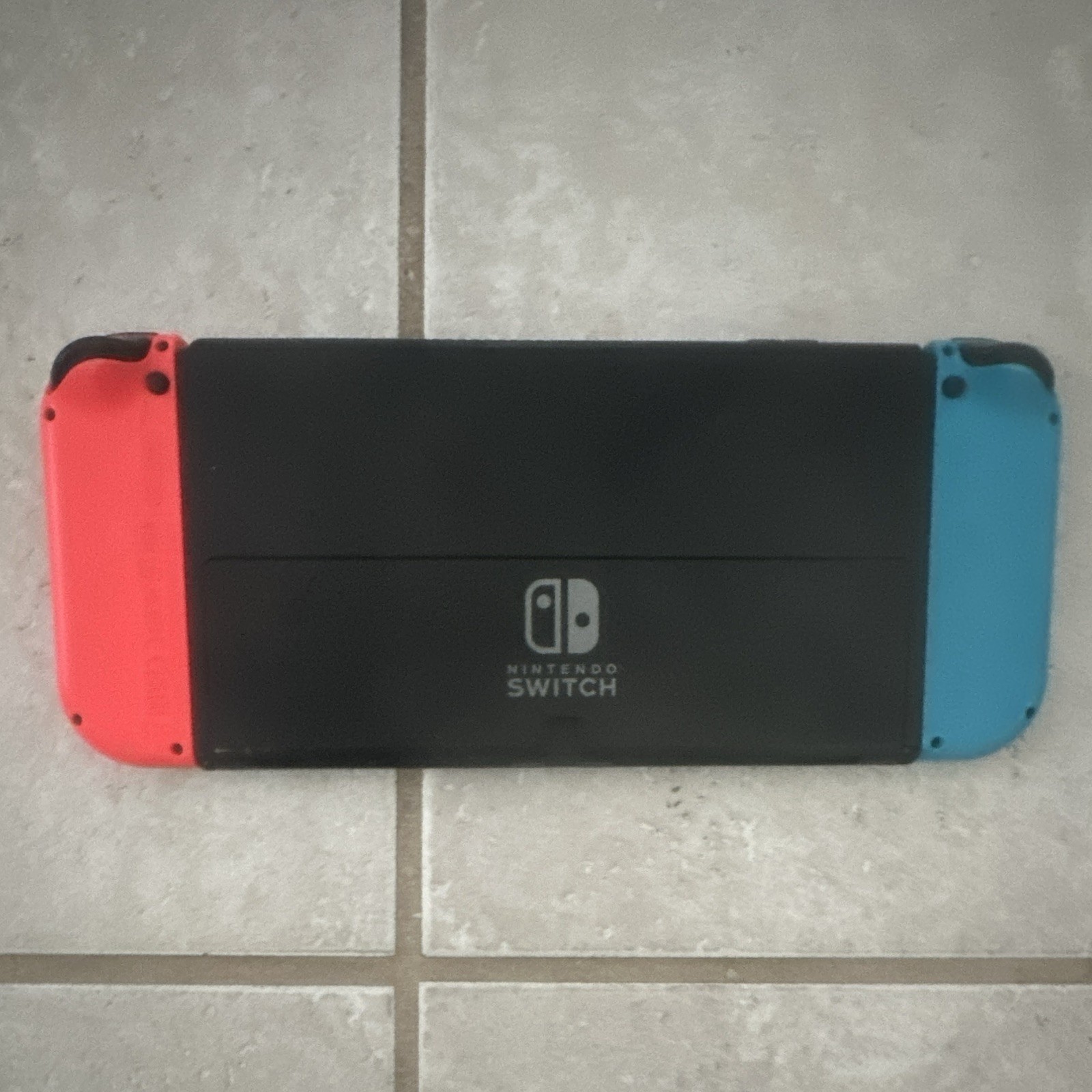 Nintendo Switch Console w/ Neon Red/Blue Joy-Con + Dock, Grip, Straps