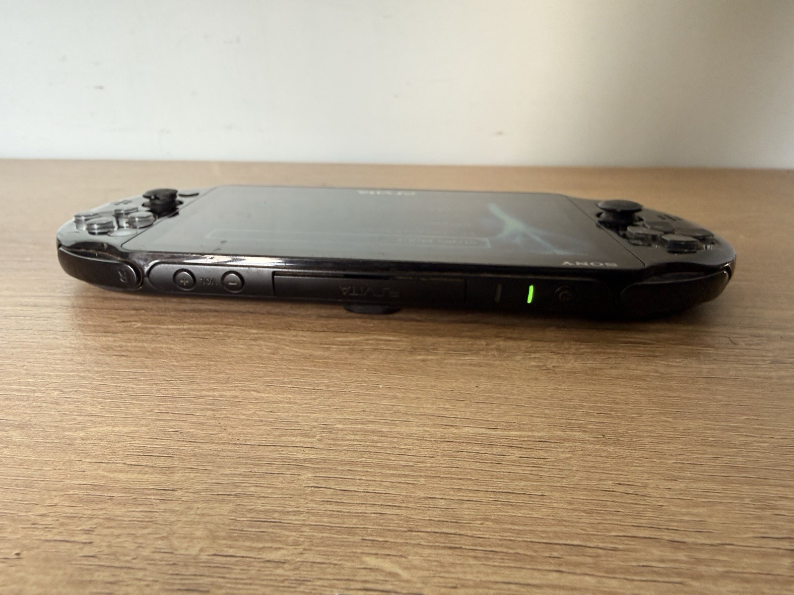 Sony PlayStation PS Vita 2001 w/ Assassins Creed – For Parts – Bad Left Joystick